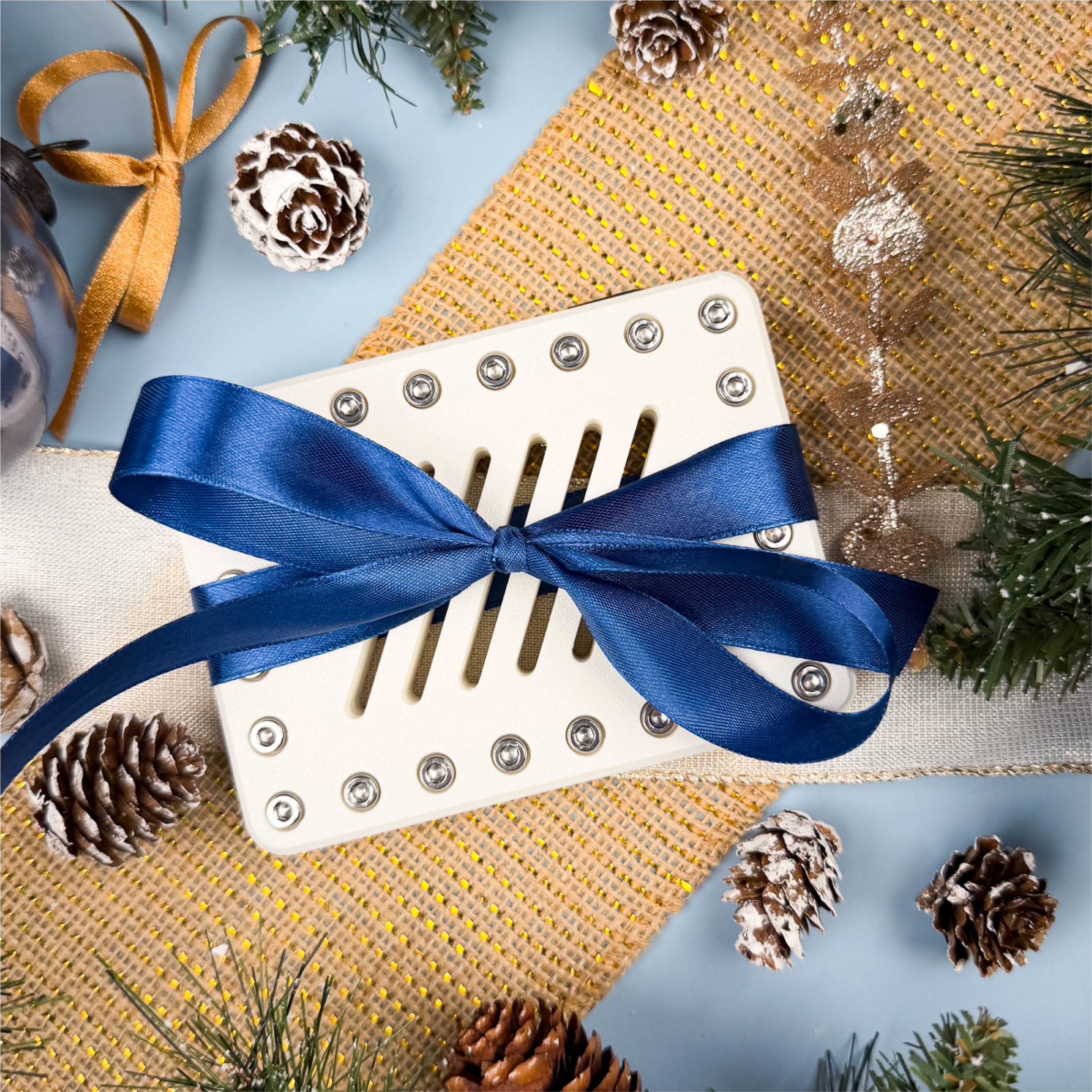 Pure Snow Lockup Gift Card Holder in white with navy ribbon. Holds cash or gift cards behind 24 screws, turning gift-giving into a challenge. Christmas gag gift, stocking stuffer, or Secret Santa.