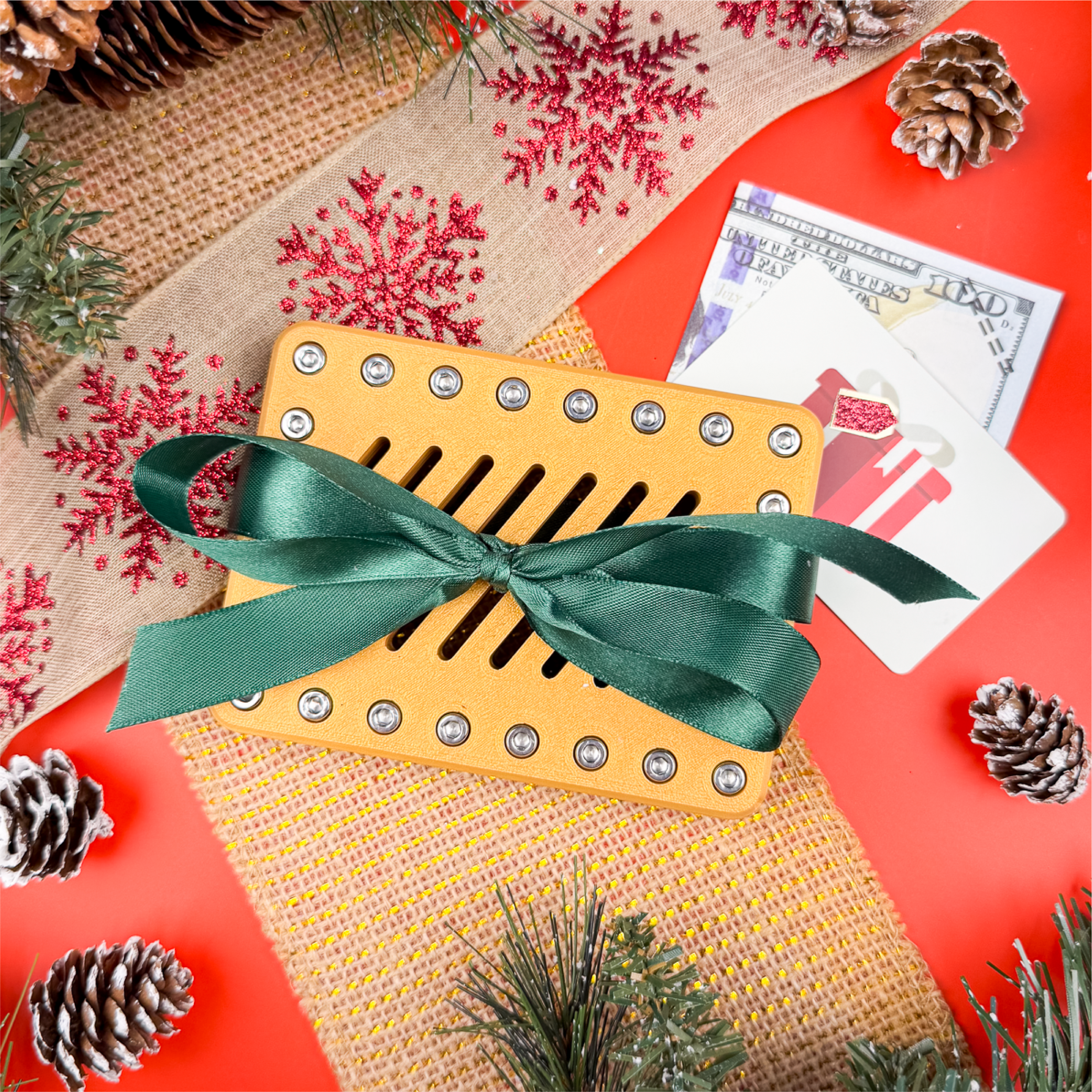 Golden Mirage Lockup Gift Card Holder in metallic gold with green ribbon. Holiday puzzle box for gift cards or cash, a funny Christmas gag gift, Secret Santa challenge, or festive stocking stuffer.
