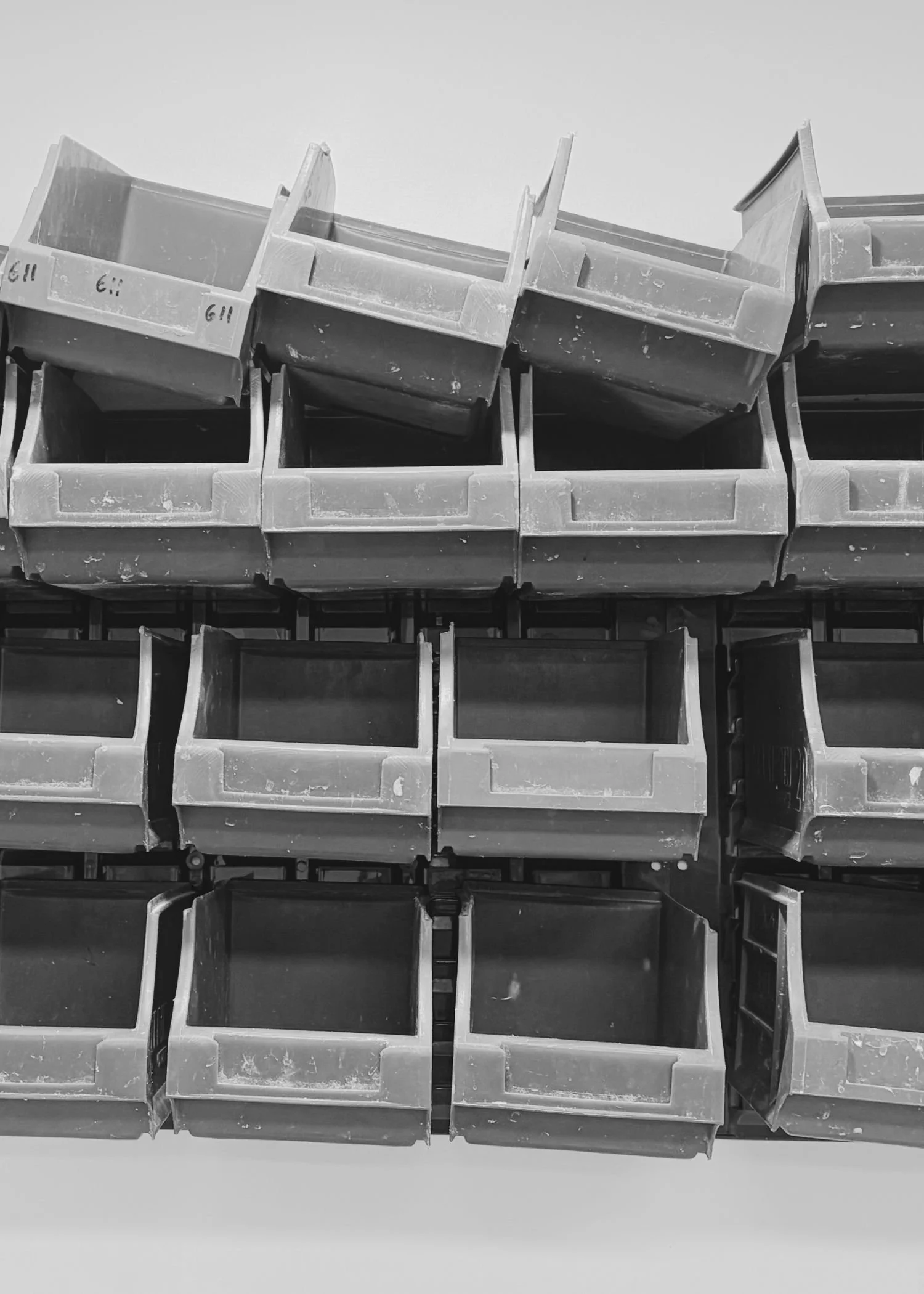 black and white image of stack of empty lab boxes