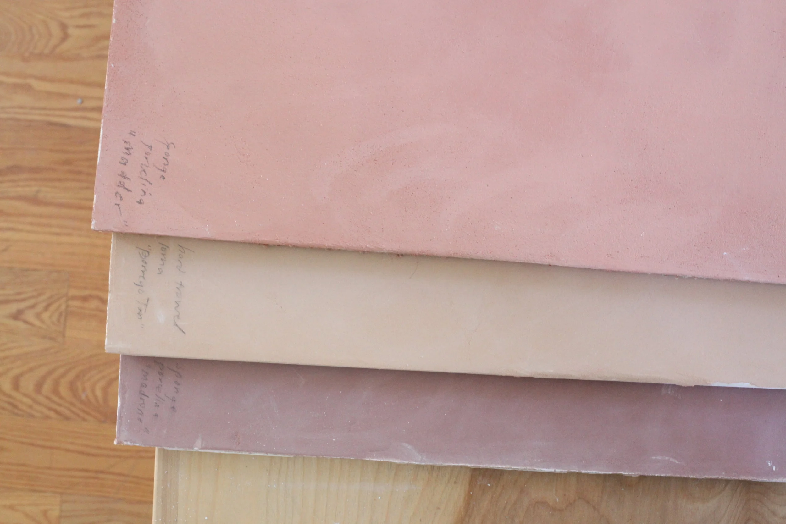  Natural clay plaster samples, tinted with earth pigments. 