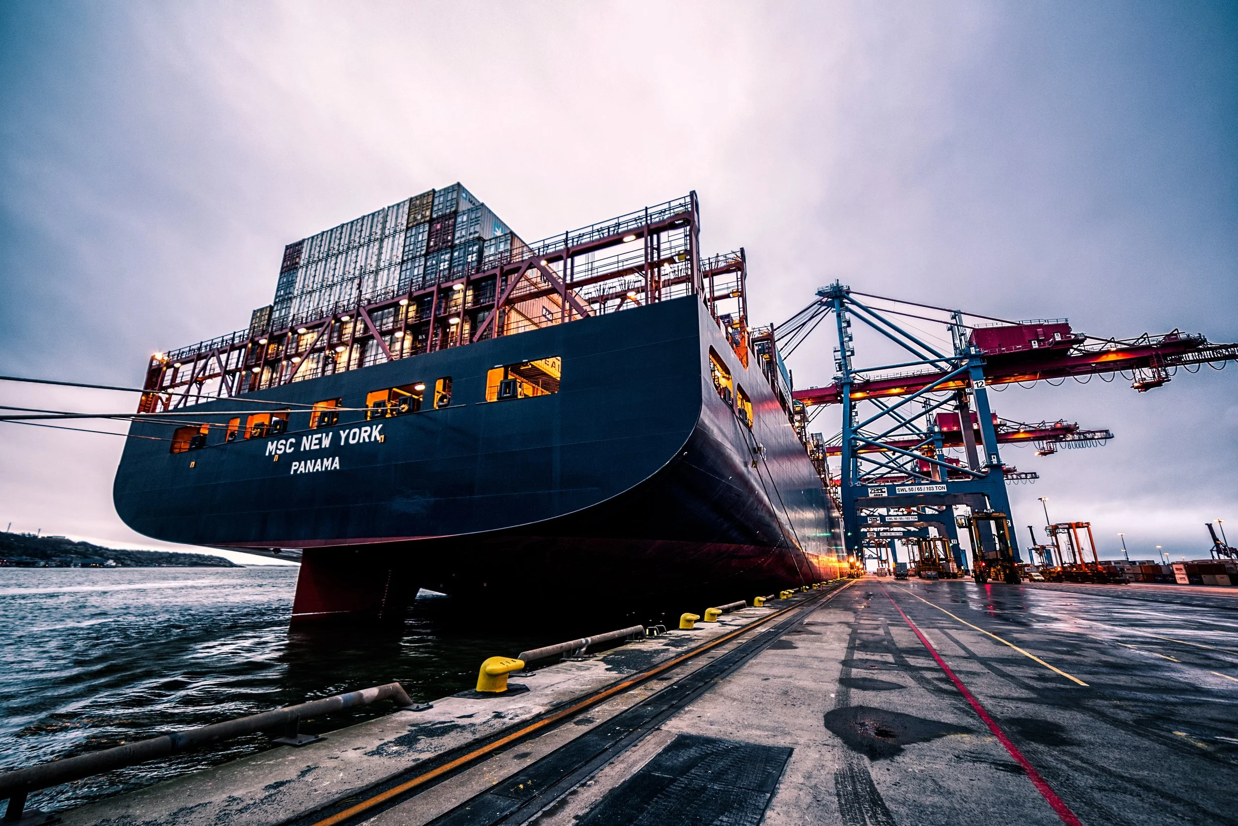 Container ship and cranes at an international cargo port