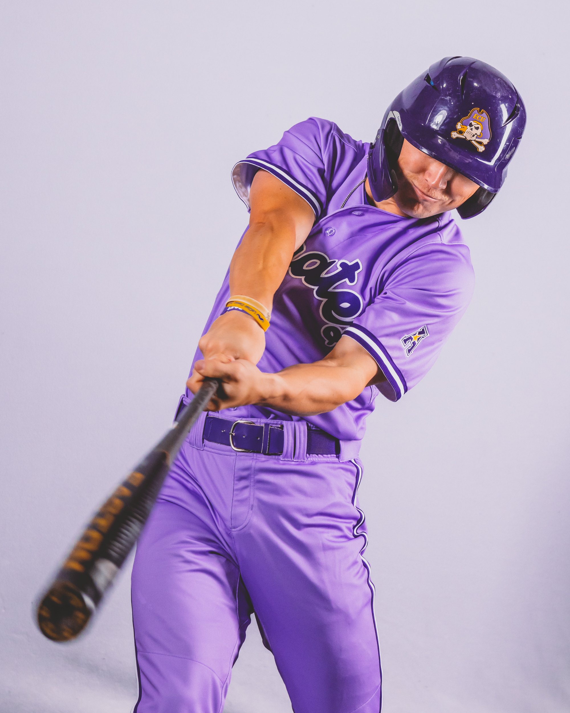 purple college baseball uniforms
