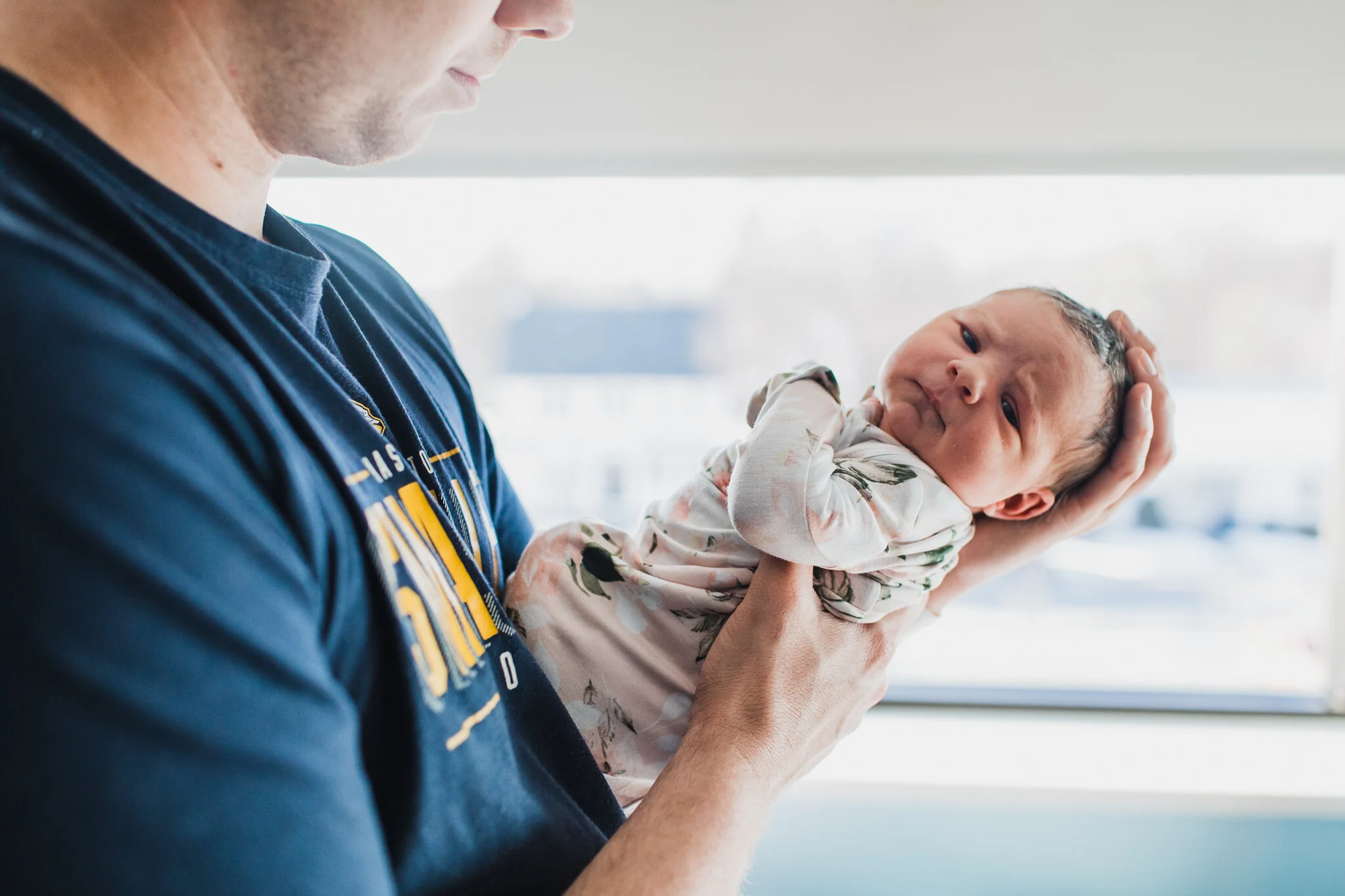 Dad holding his daughter
