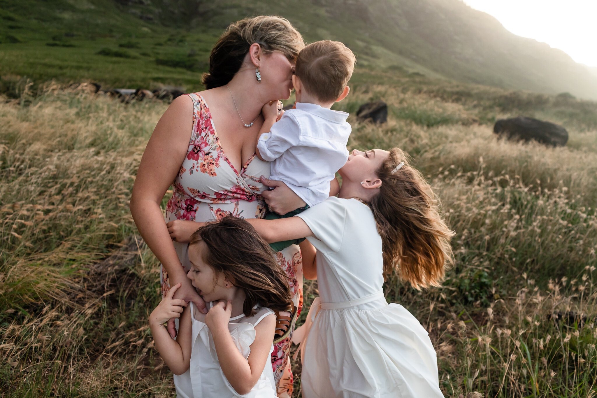 Mom and her children hugging in the wind in Watertown, NY
