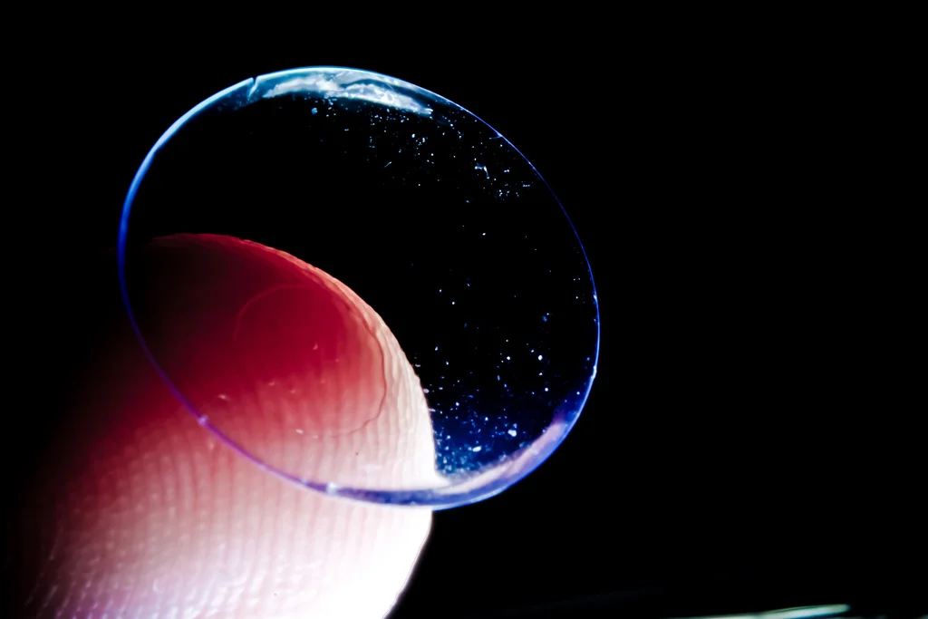 Contact lenses on the tip of a finger