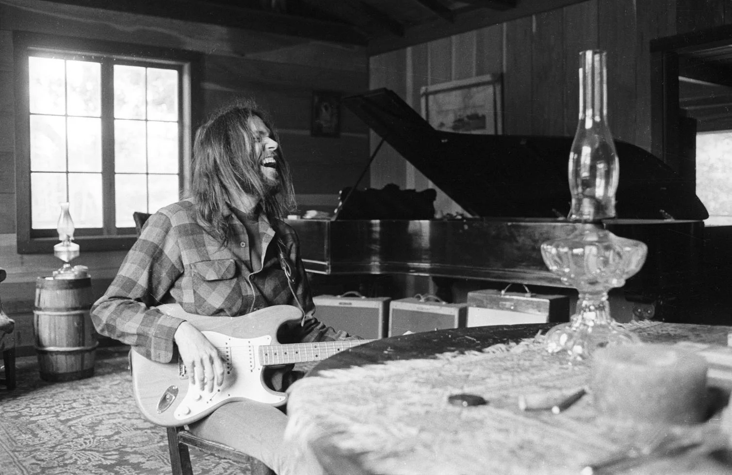 Neil Young, Laughing, Broken Arrow Ranch, Half Moon Bay, CA 1971 by Henry Diltz
