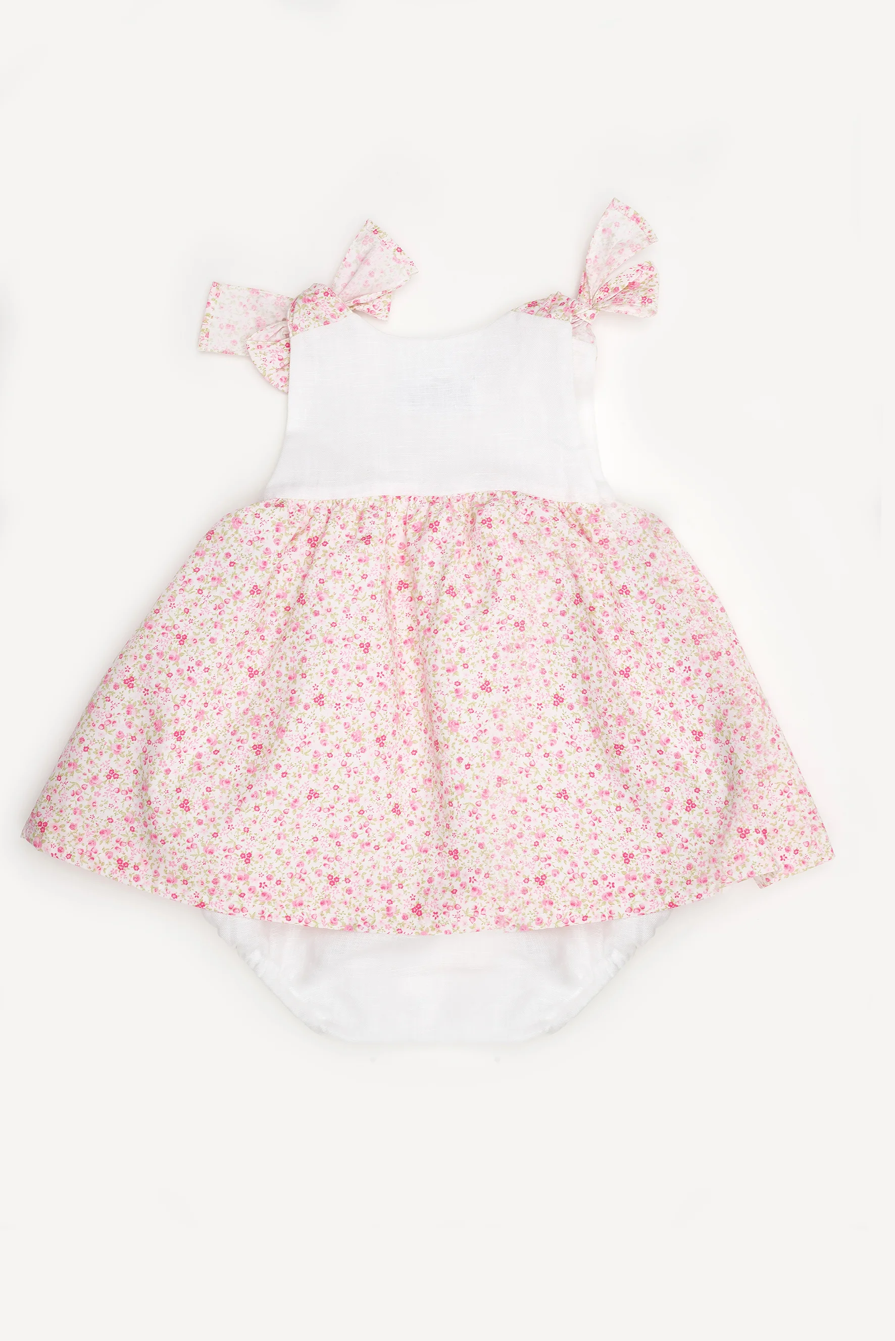 Pagliaccetto neonata con fiocchi a fiori rosa retro