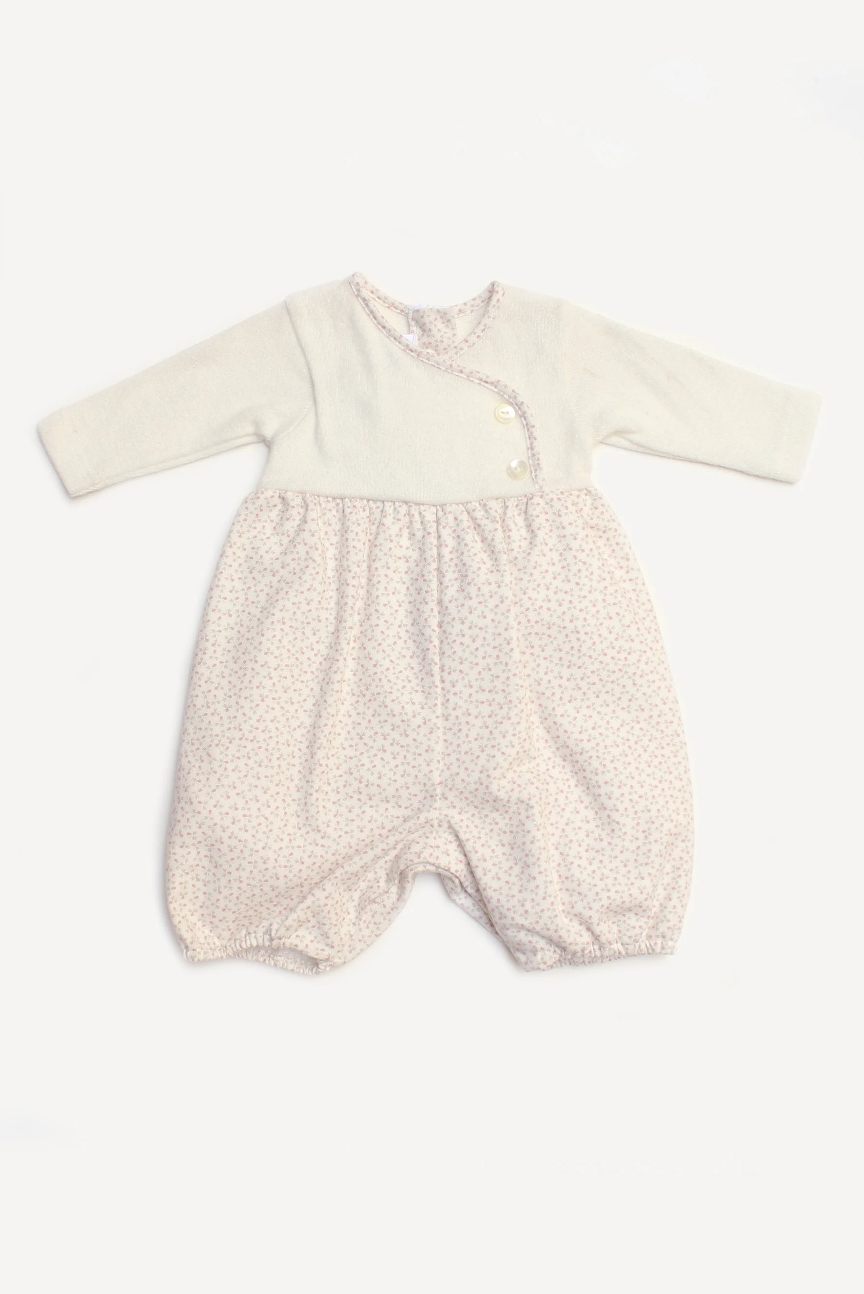 Pagliaccetto neonata in maglia e fiorellini 