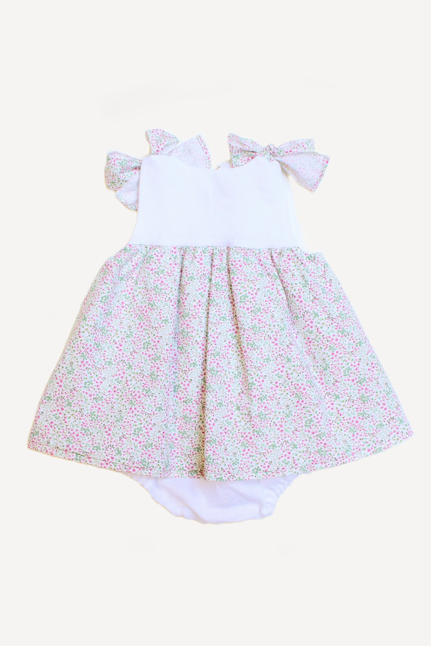 Pagliaccetto neonata con fiocchi a fiori retro