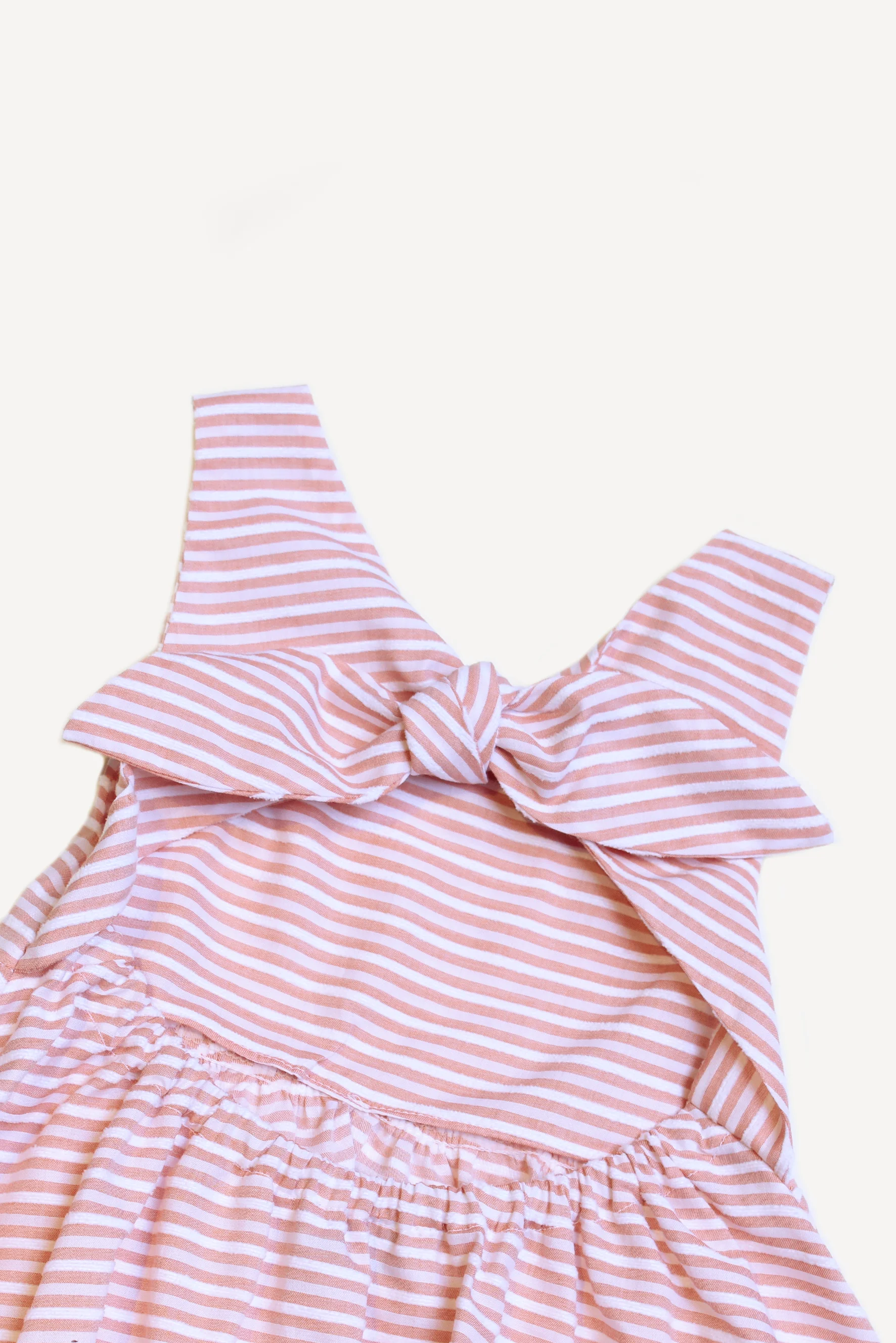 Scamiciato bambina a righe corallo fiocco