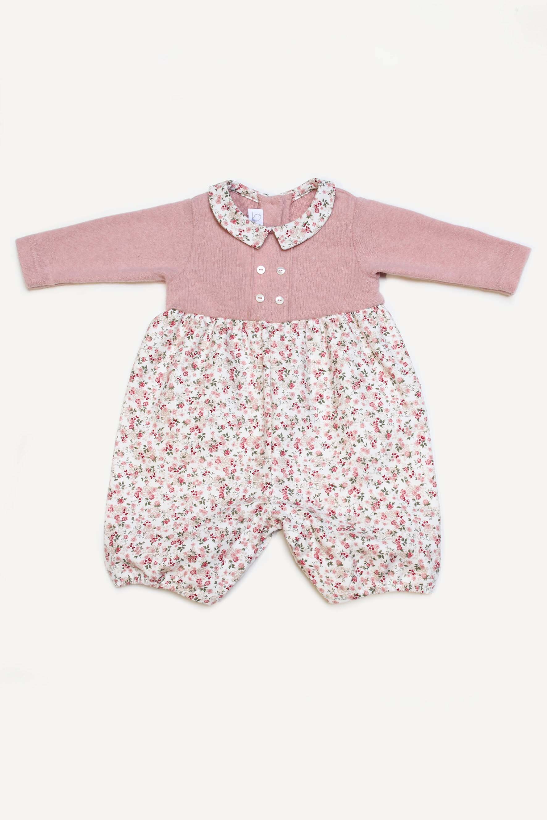 Pagliaccetto neonata in maglia rosa e fiori rosa 
