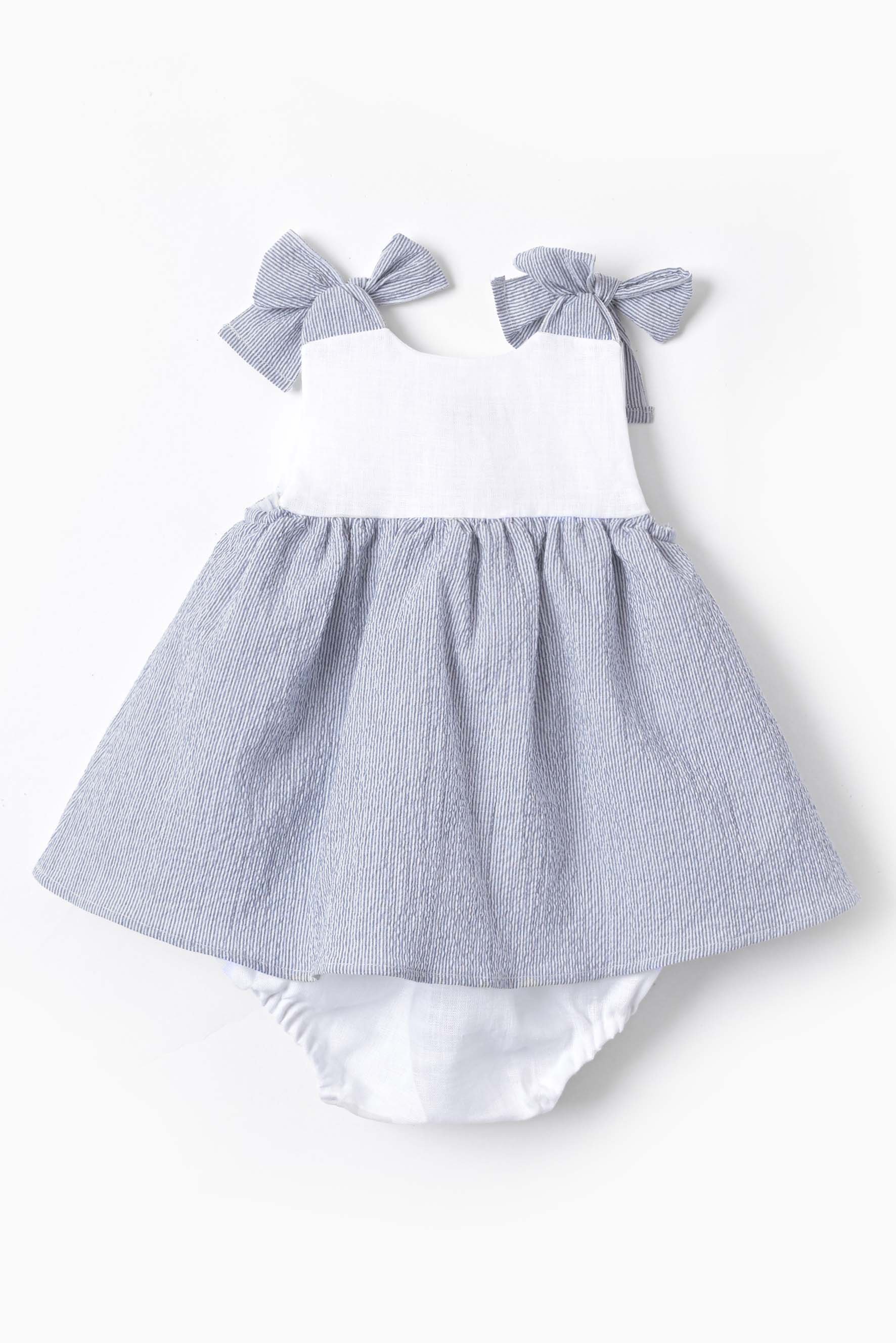 Pagliaccetto neonata fiocchi in righina blu retro