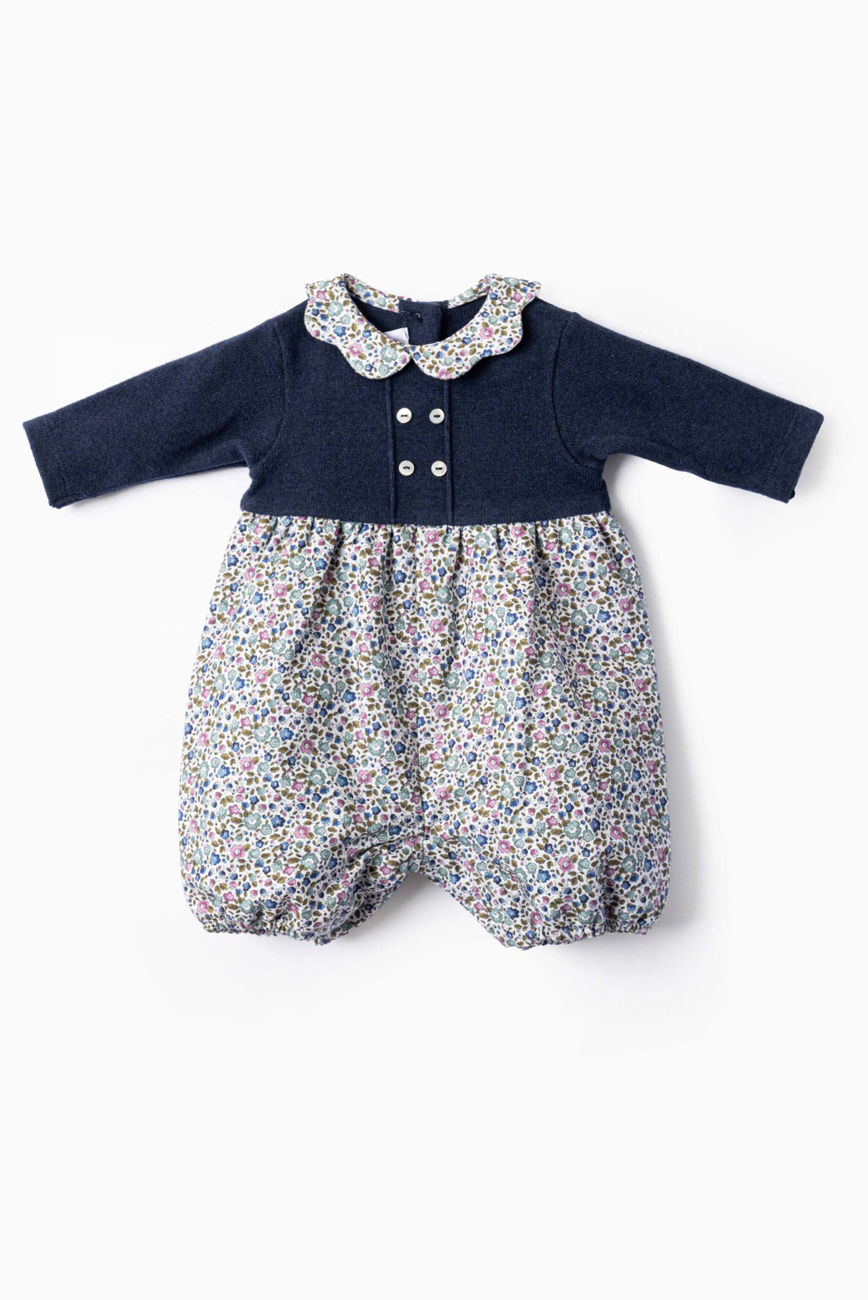 Pagliaccetto neonata maglia blu e fiorellino blu