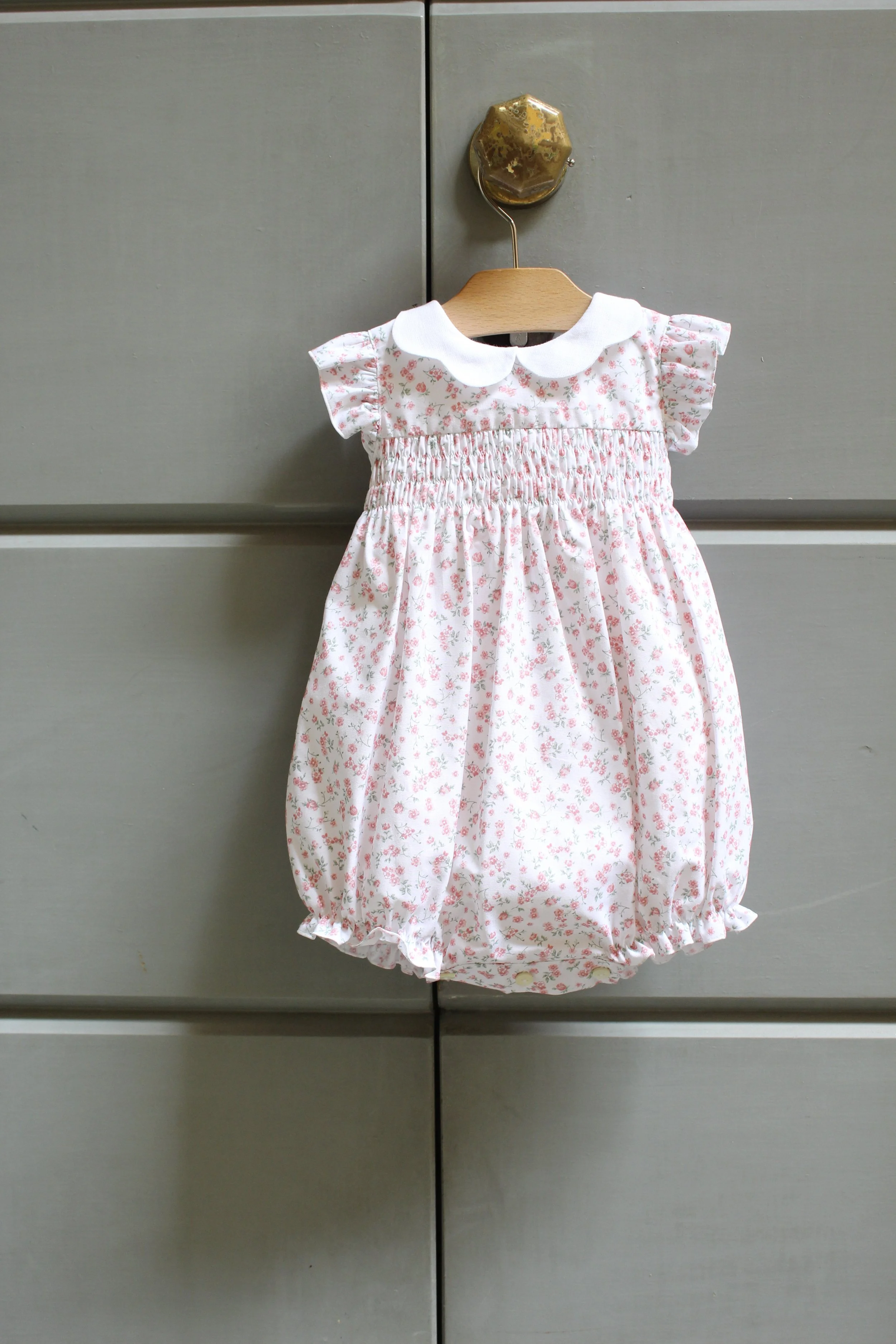 Pagliaccetto neonata fiorellino rosa