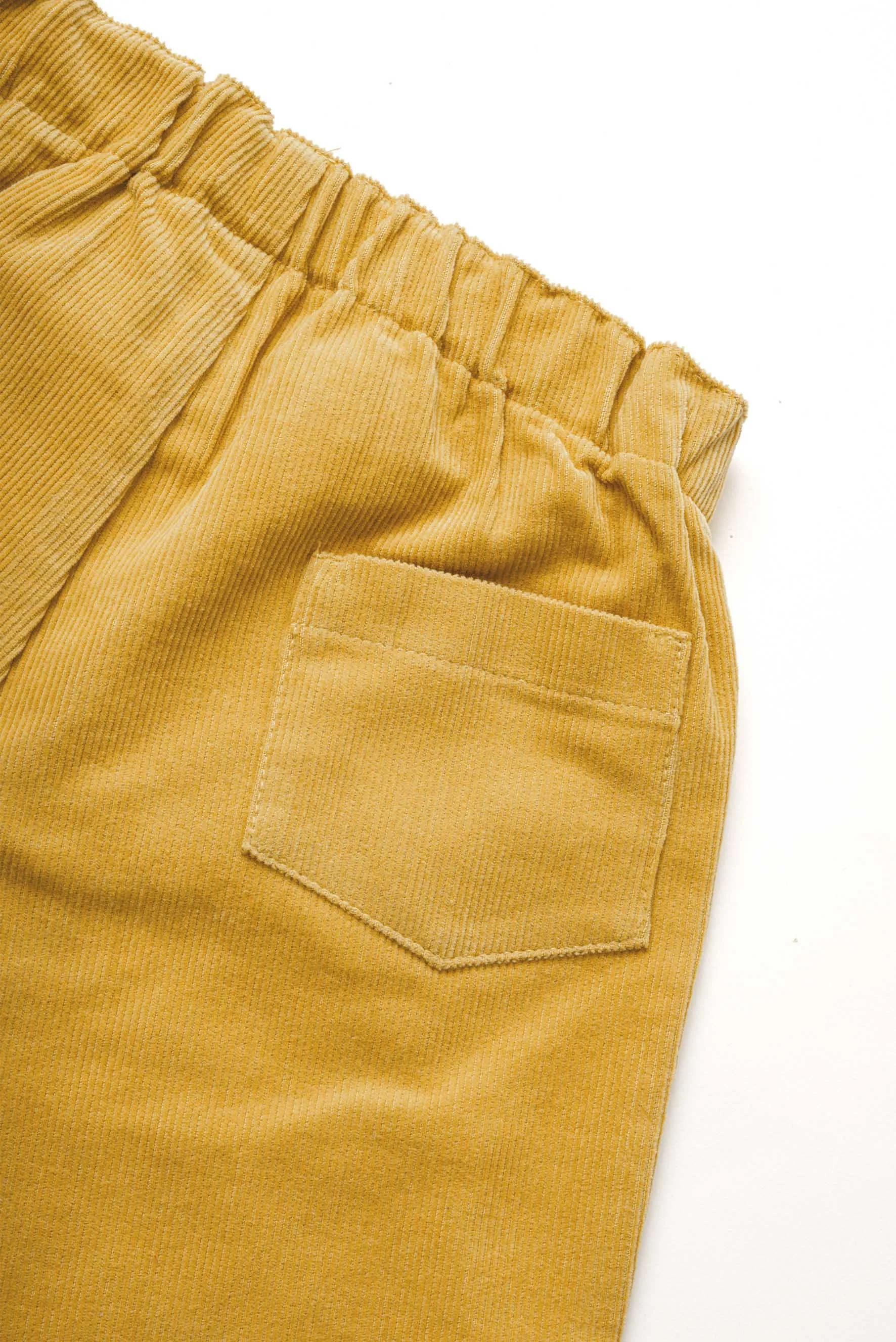 Pantaloni asilo unisex in velluto a coste sottili senape dettaglio tasca retro