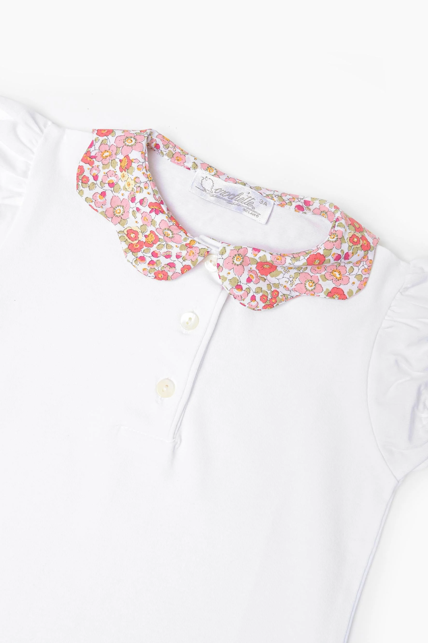 Polo bambina jersey bianco e fiore arancione Crochette