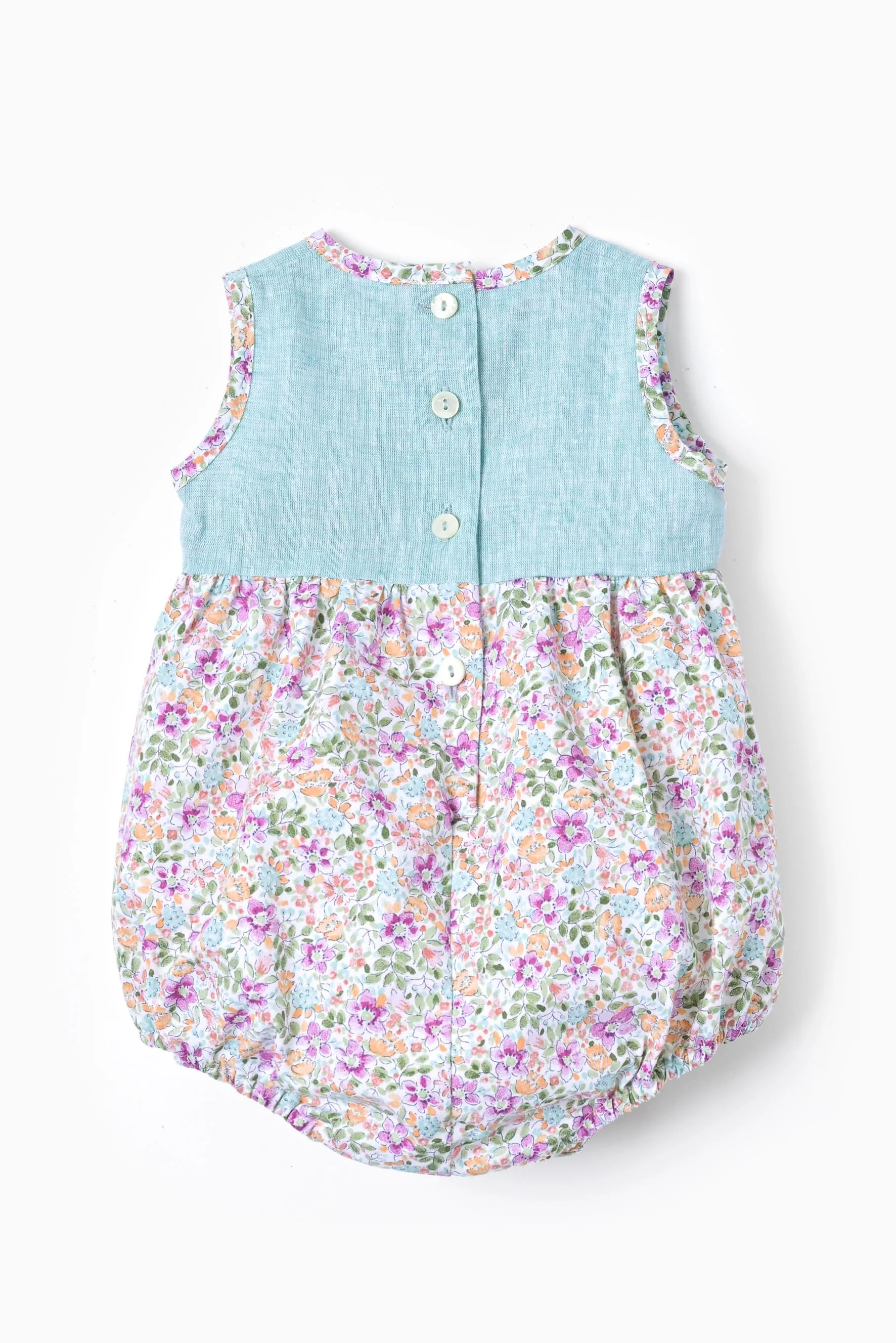 Pagliaccetto neonata lino turchese e fiore viola retro.jpg