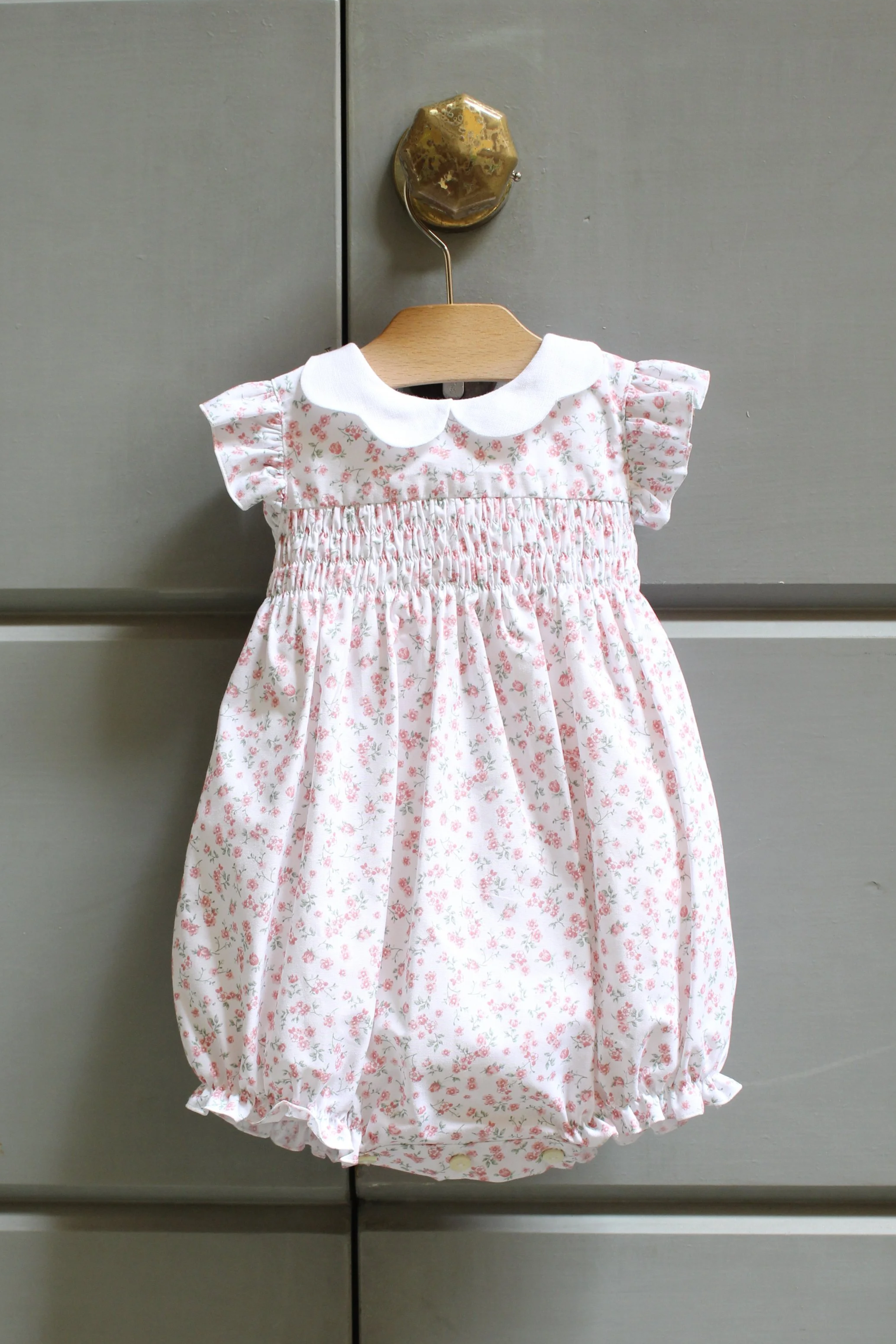 Pagliaccetto neonata fiorellino rosa