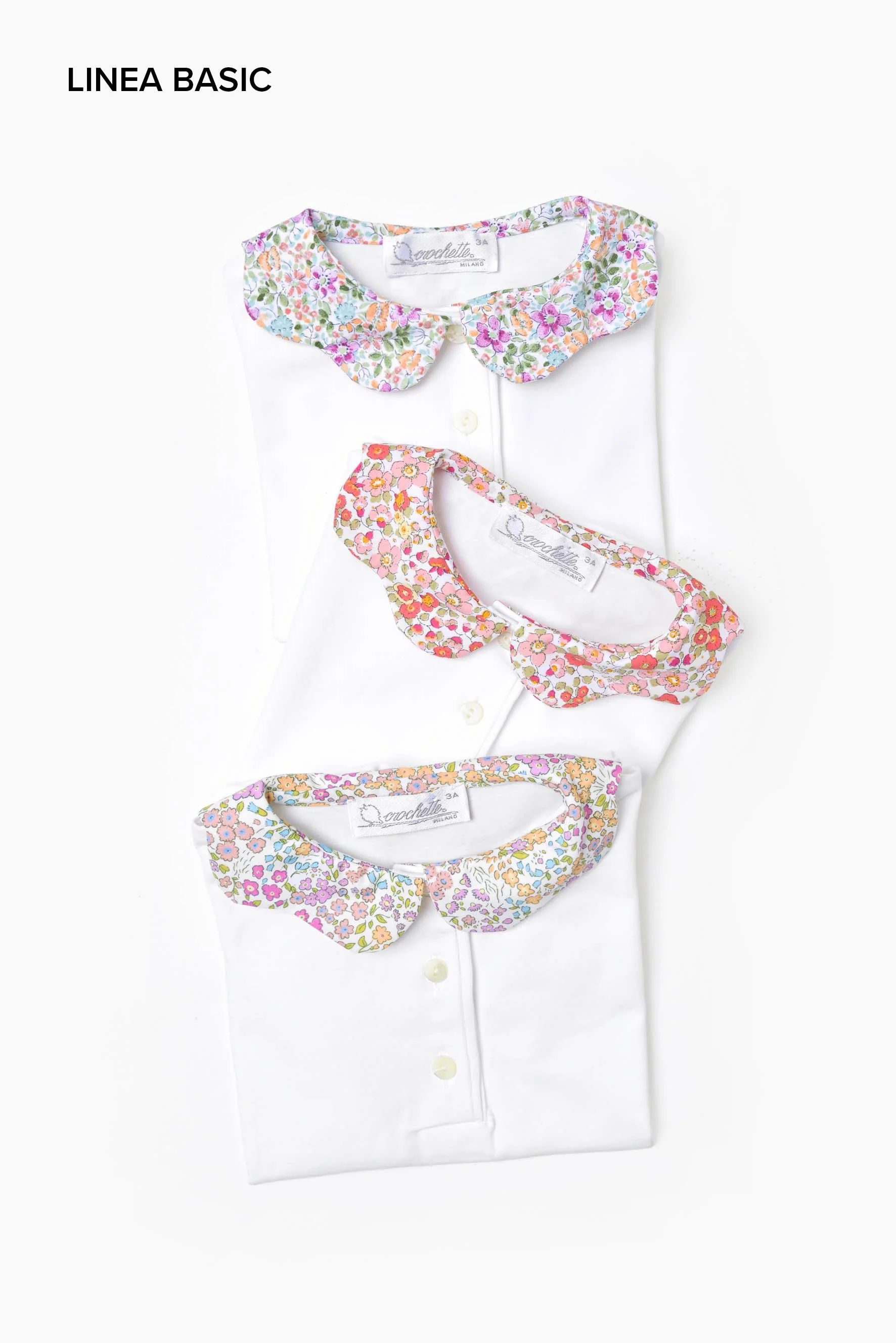 Polo bambina jersey bianco e petalo a fiori