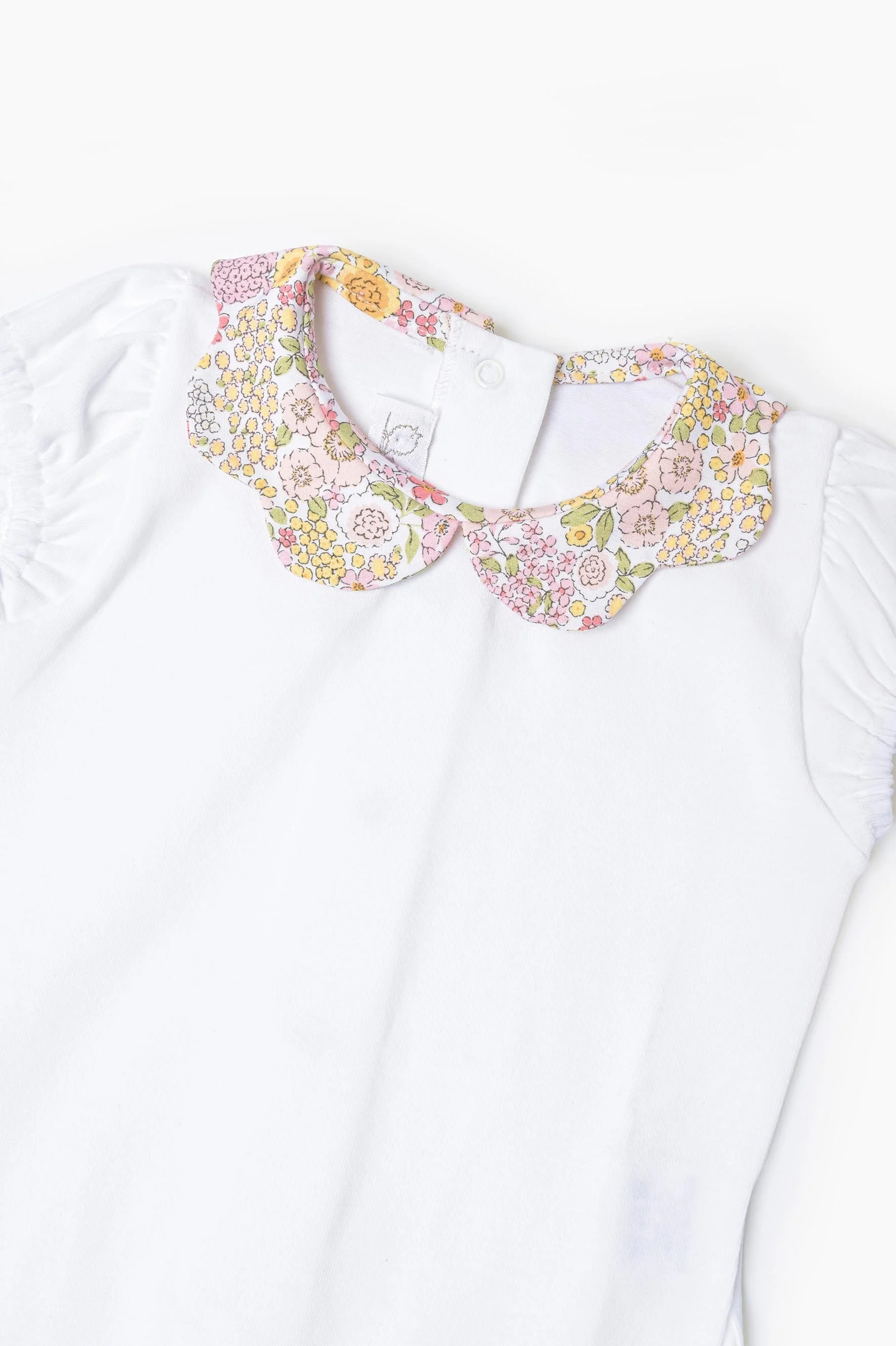 Body neonata jersey bianco e fiore rosa giallo