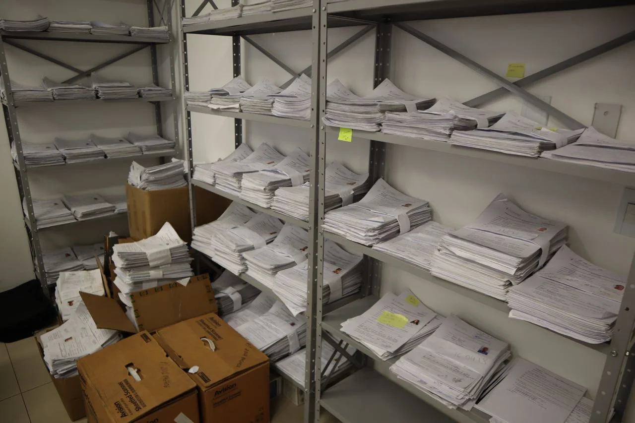 Stack of asylum applications waiting to be processed by Brazilian Federal Police in Boa Vista. 