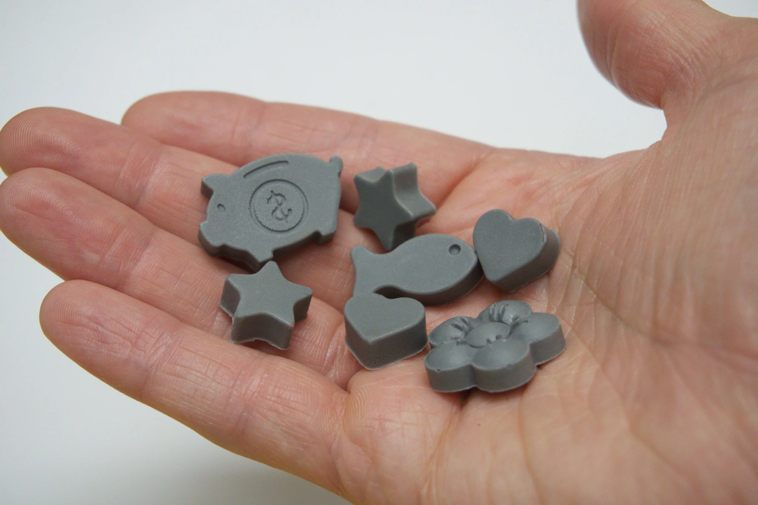 Gray wax pour  in hand.jpg