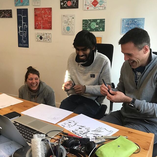 Sandra, Nicolas and Michael are admiring the result of an intense #speeddrawing challenge during lunch time.