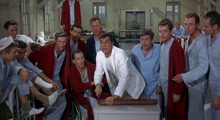 Tony Curtis as Corporal Jackson “Jake” Leibowitz in Captain Newman, M.D. ’s Ward 7