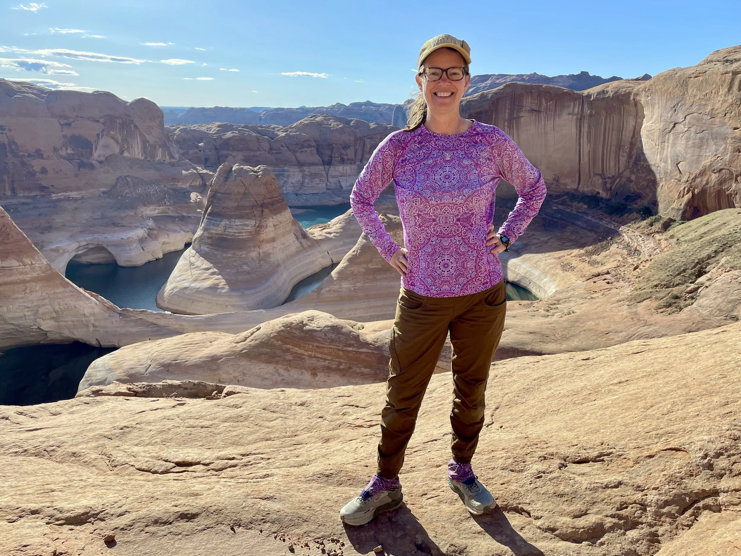 Yoga, Mindfulness, and Nature Therapy Guide Michelle Wilson of Radiant Wellness Solutions doing a little "research" at Reflection Canyon, Utah.