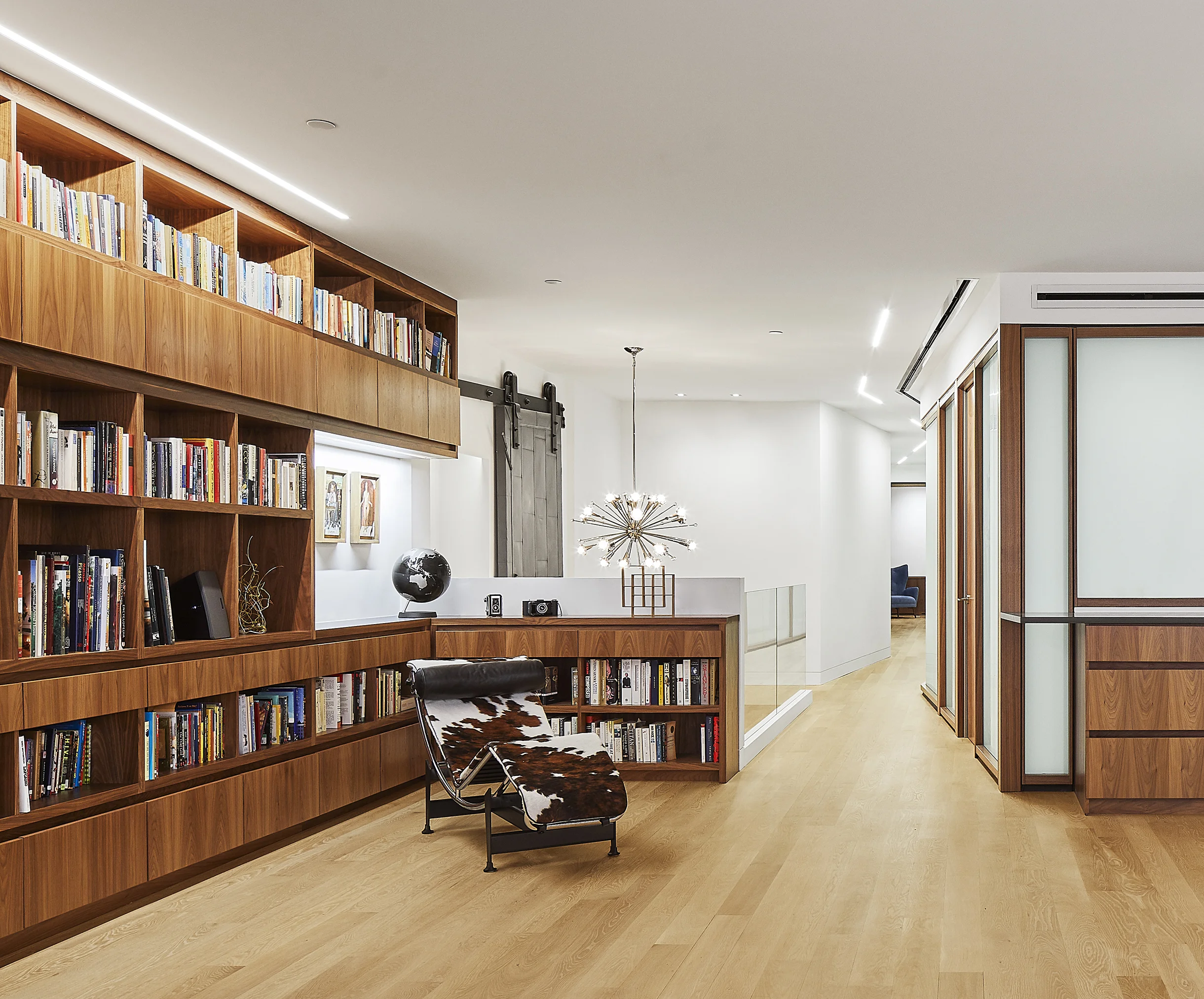 turkel_design_modern_prefab_home_soho_loft_living_room_storage_shelving.jpg