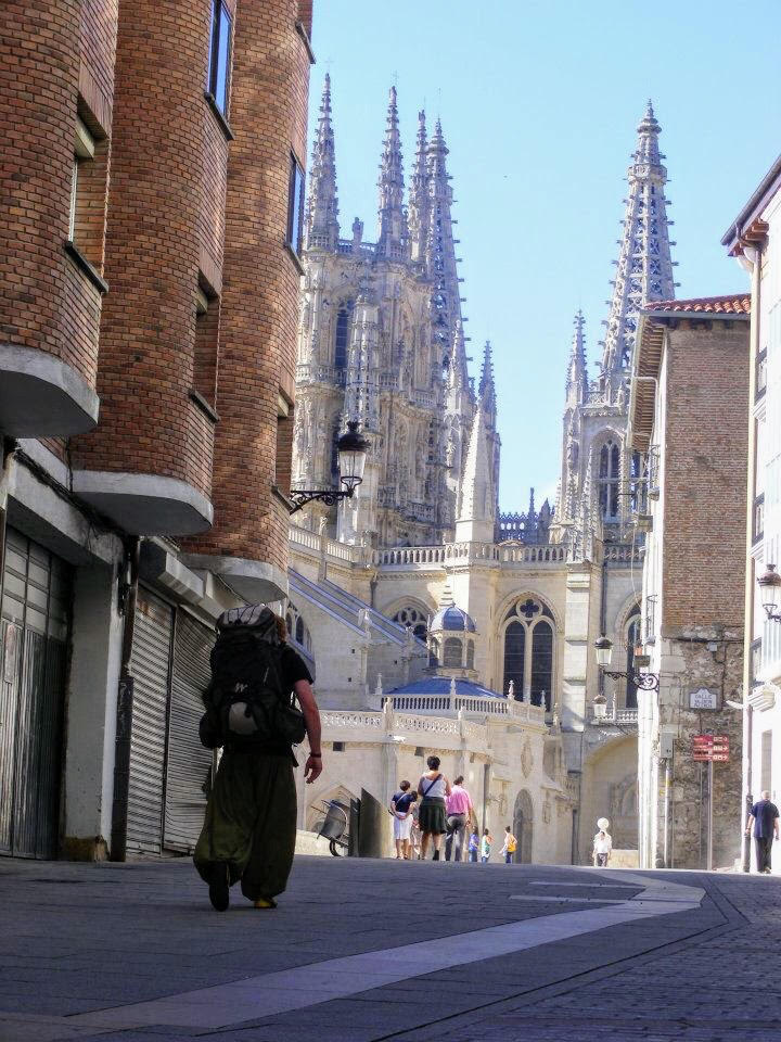 Matt backpacking in the city of Burgos, with the cathedral spires in the background