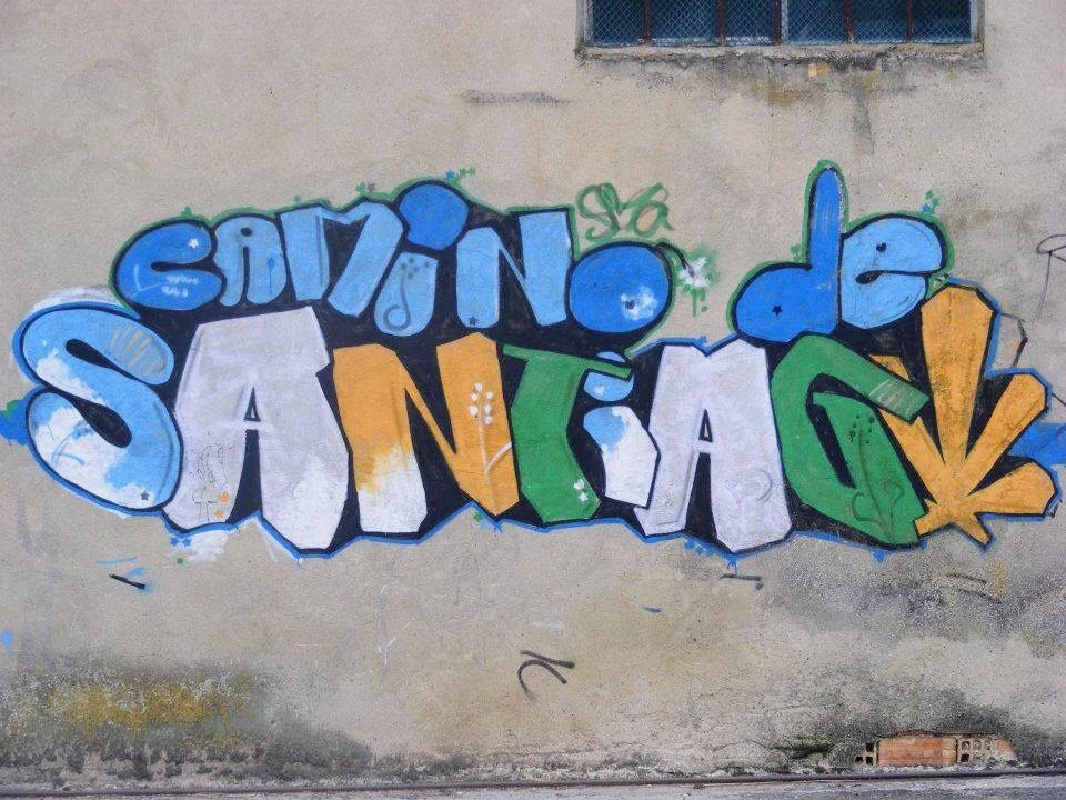 Graffiti art on a wall along the Camino