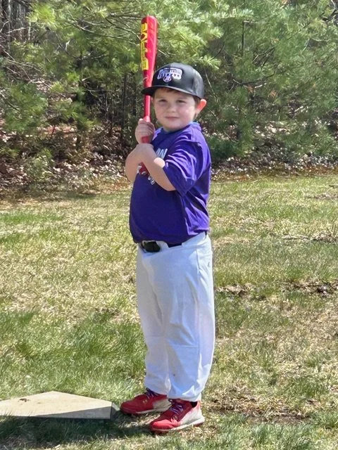 Max in his baseball uniform