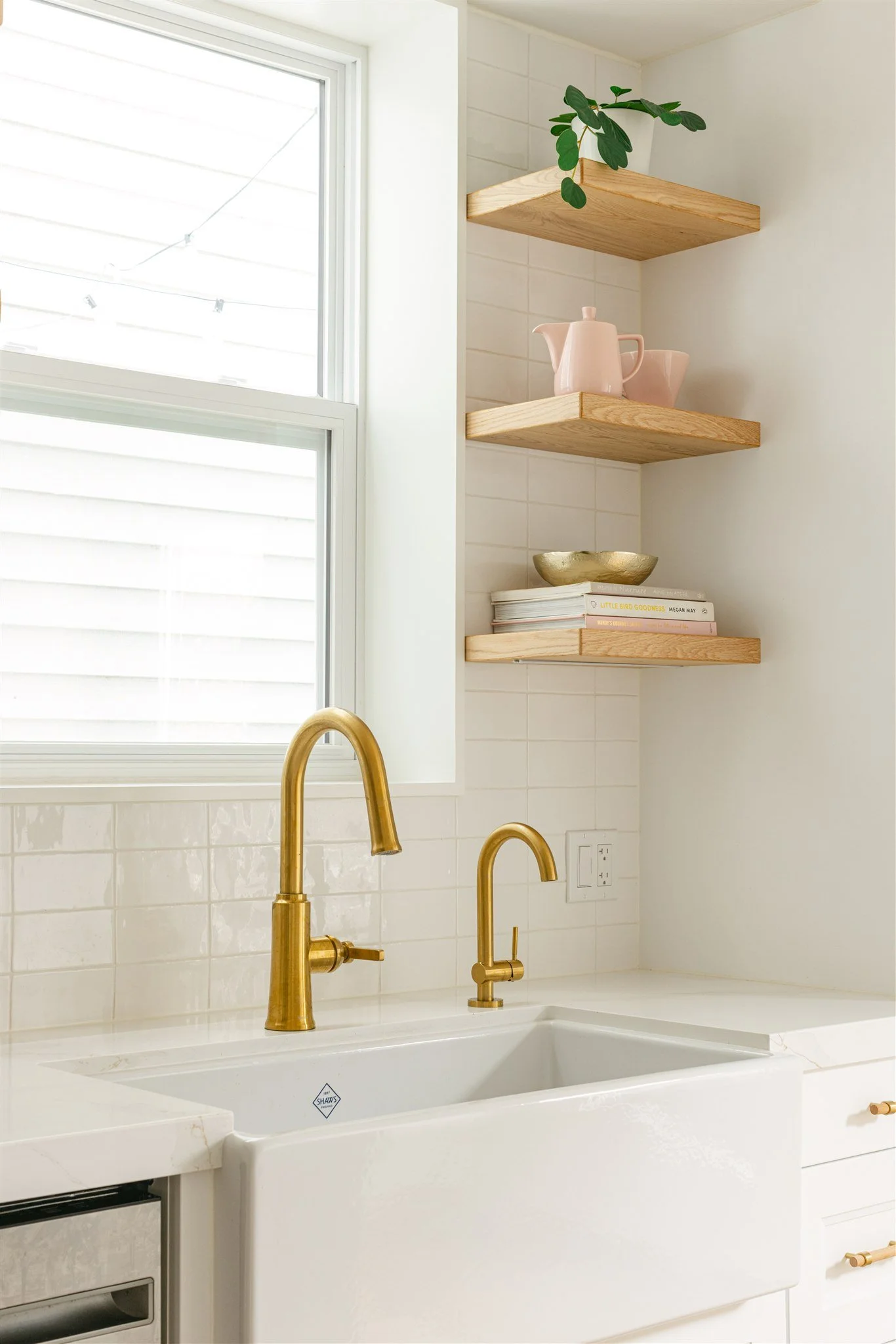 farmhouse sink with brass accents
