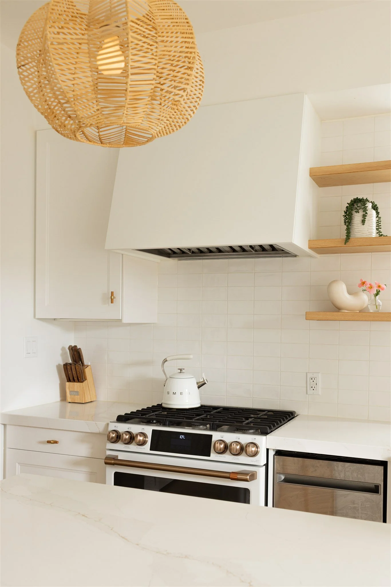white kitchen with brass accents