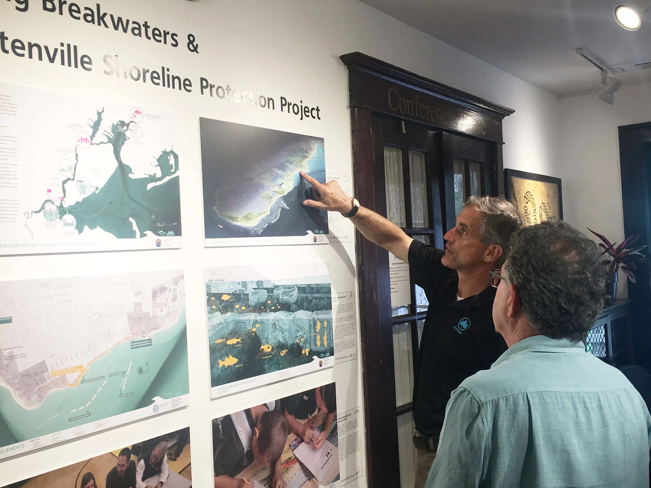 John Kilcullen points out to David Berg the current locations along Staten Island's south shore of The Harbor School's Billion Oyster project.