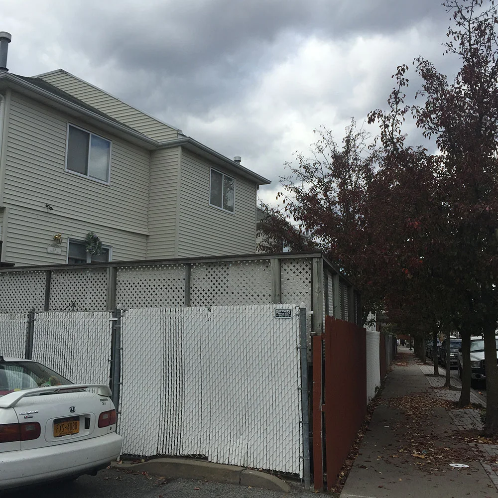  This rental housing development was permitted to be sited literally with its back to Main Street. Multiple layers of fencing abut the Main Street's sidewalk. The property owner has ignored the community's complaints to address this eyesore and the N