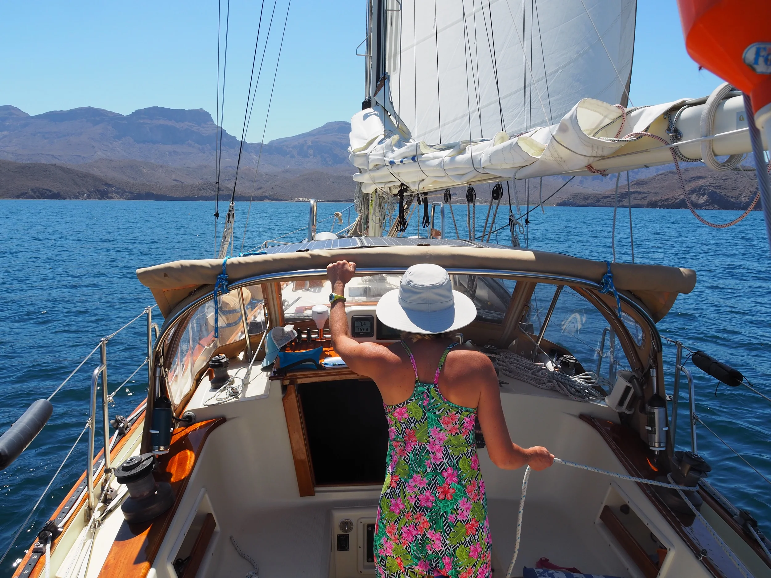 Light air sailing with just the jib as we steal every bit of pressure we can out of four knots of wind to push us slowly into an anchorage. Sure, we could have fired up the motor and saved ourselves a few hours but where would be the fun in that?