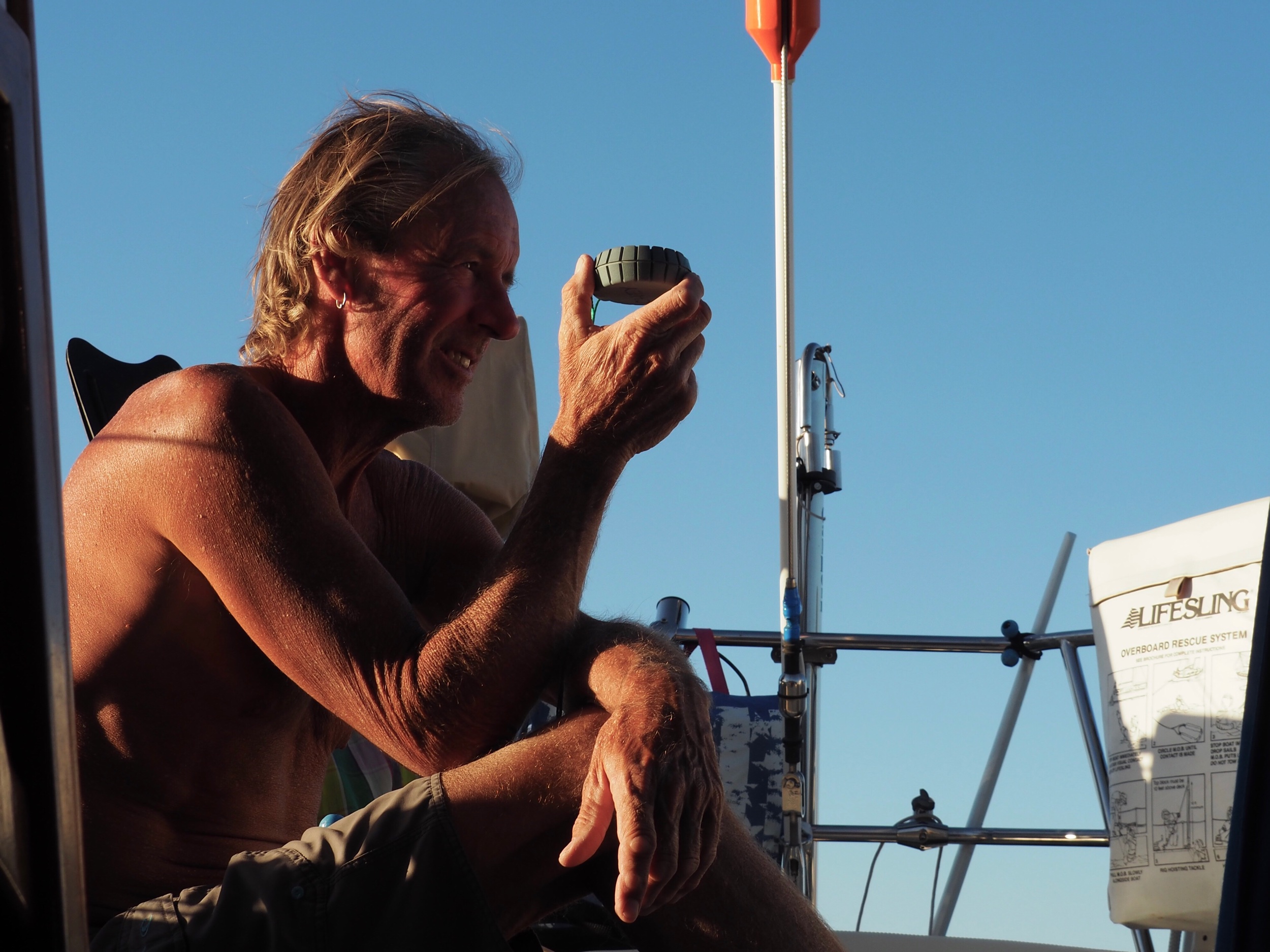 The good captain checks his bearings as the evening westerlies start whipping through the anchorage.