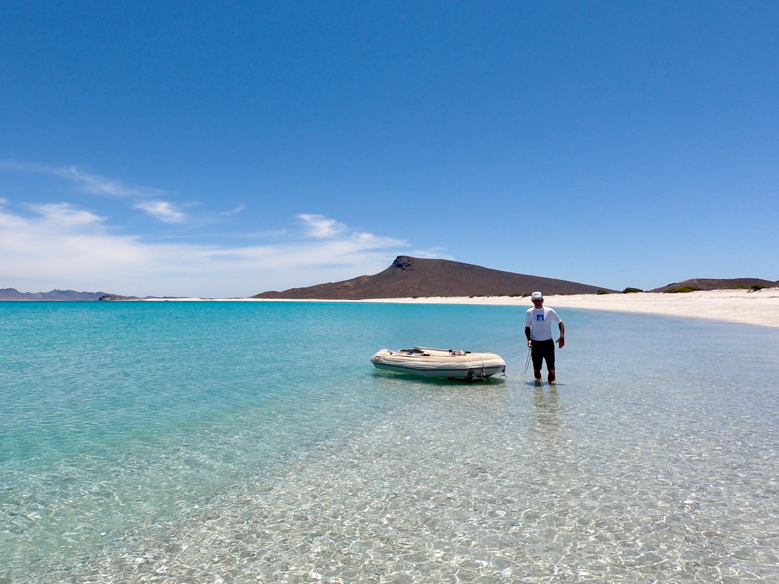 This entire bay at Playa Bonanza was ours alone for three days of bliss. The beach was so long, Colin decided towing the dinghy was easier than rowing it. :)
