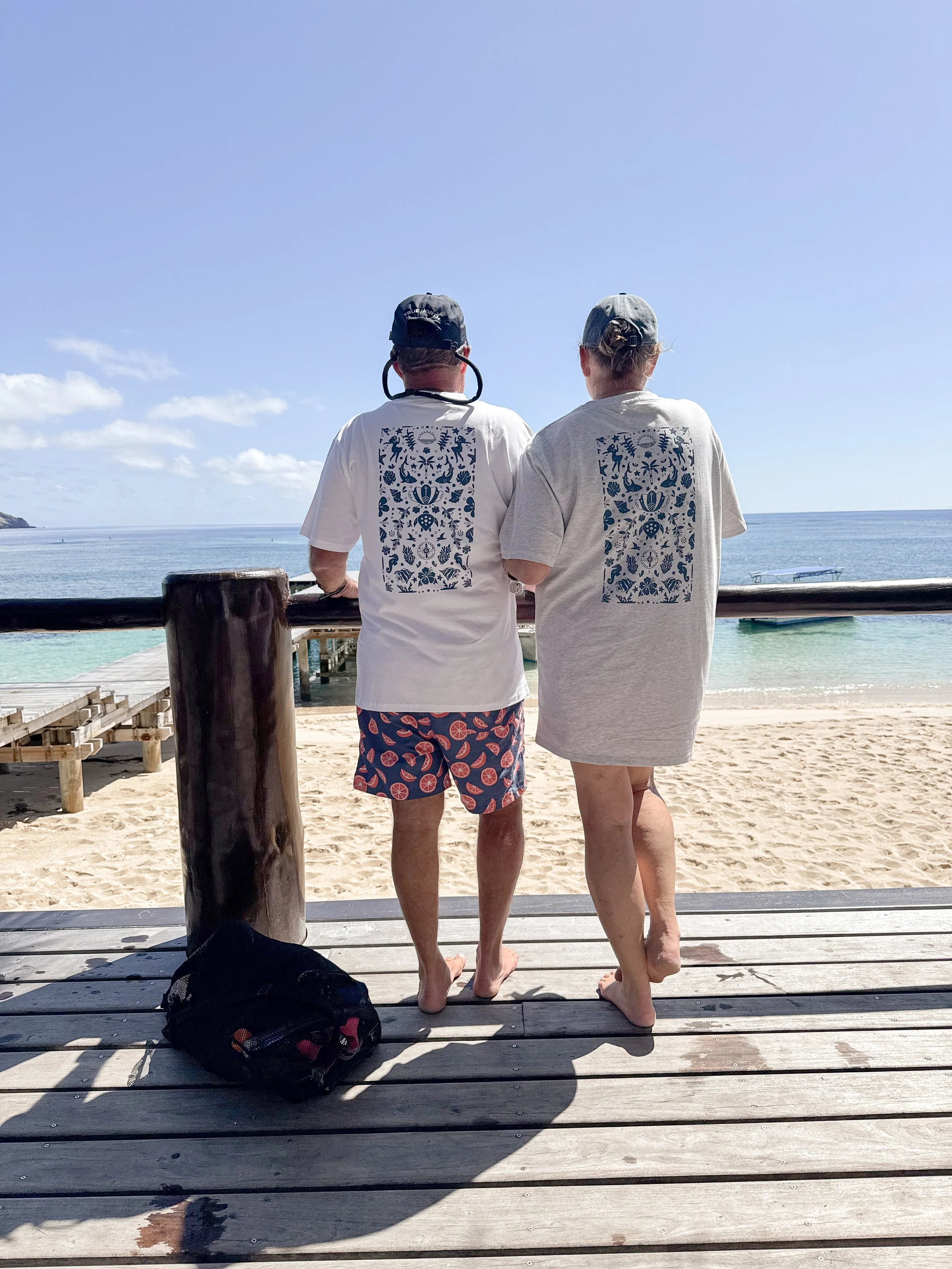 Dive T-shirts in White and Snow Marle with Petrol Blue design.  Available for purchase only at Tokoriki Island Resort Dive Shop on Tokoriki Island.