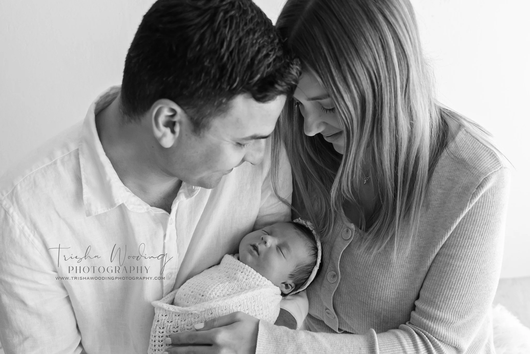 This is what the newborn stage looks like when everything else fades away.

Quiet moments. Soft breaths. Two parents leaning in, completely absorbed in this tiny new life they&rsquo;ve created. The way their heads rest together, the way their eyes ar