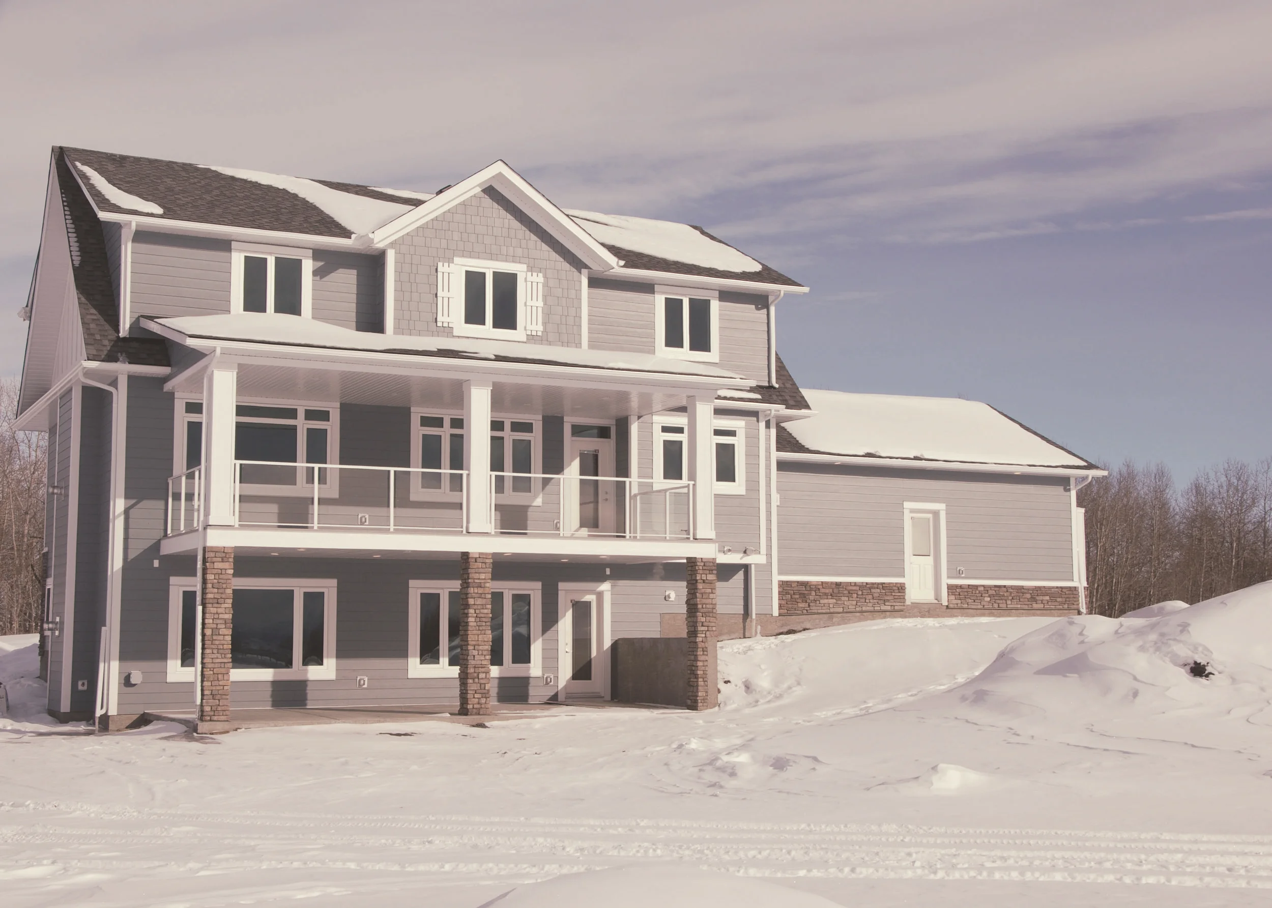 The back of the home faces westward towards the majestic rocky mountains. The covered patios make indoor-outdoor living accessible and comfortable.