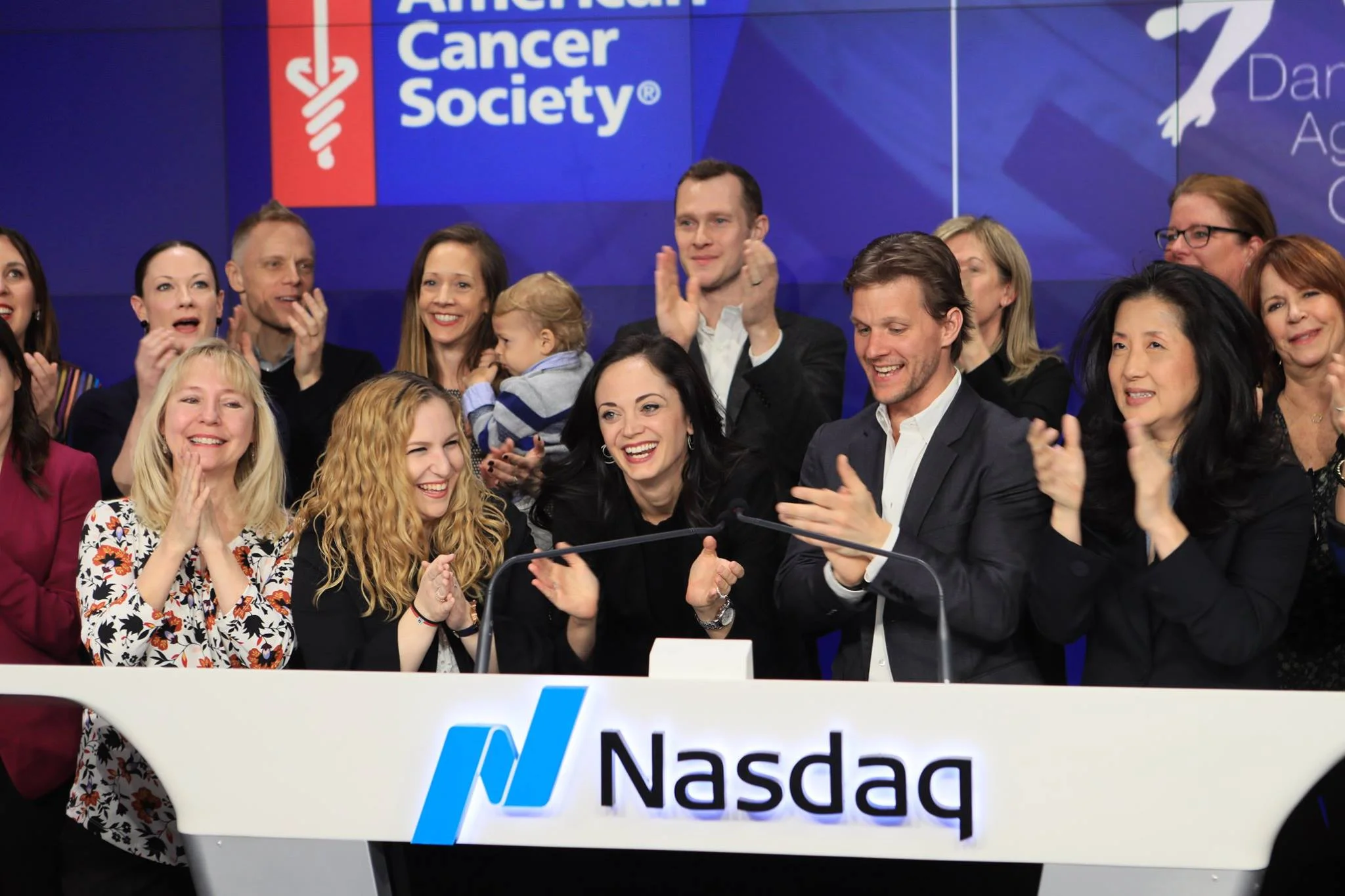 Erin Fogarty-Bittner and her Dance Against Cancer Co-Founder ring the NASDAQ Closing Bell on March 22, 2018