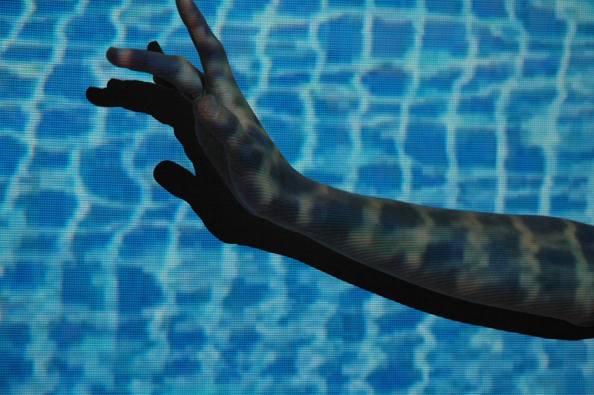 Small Hand in Water Blue.jpg