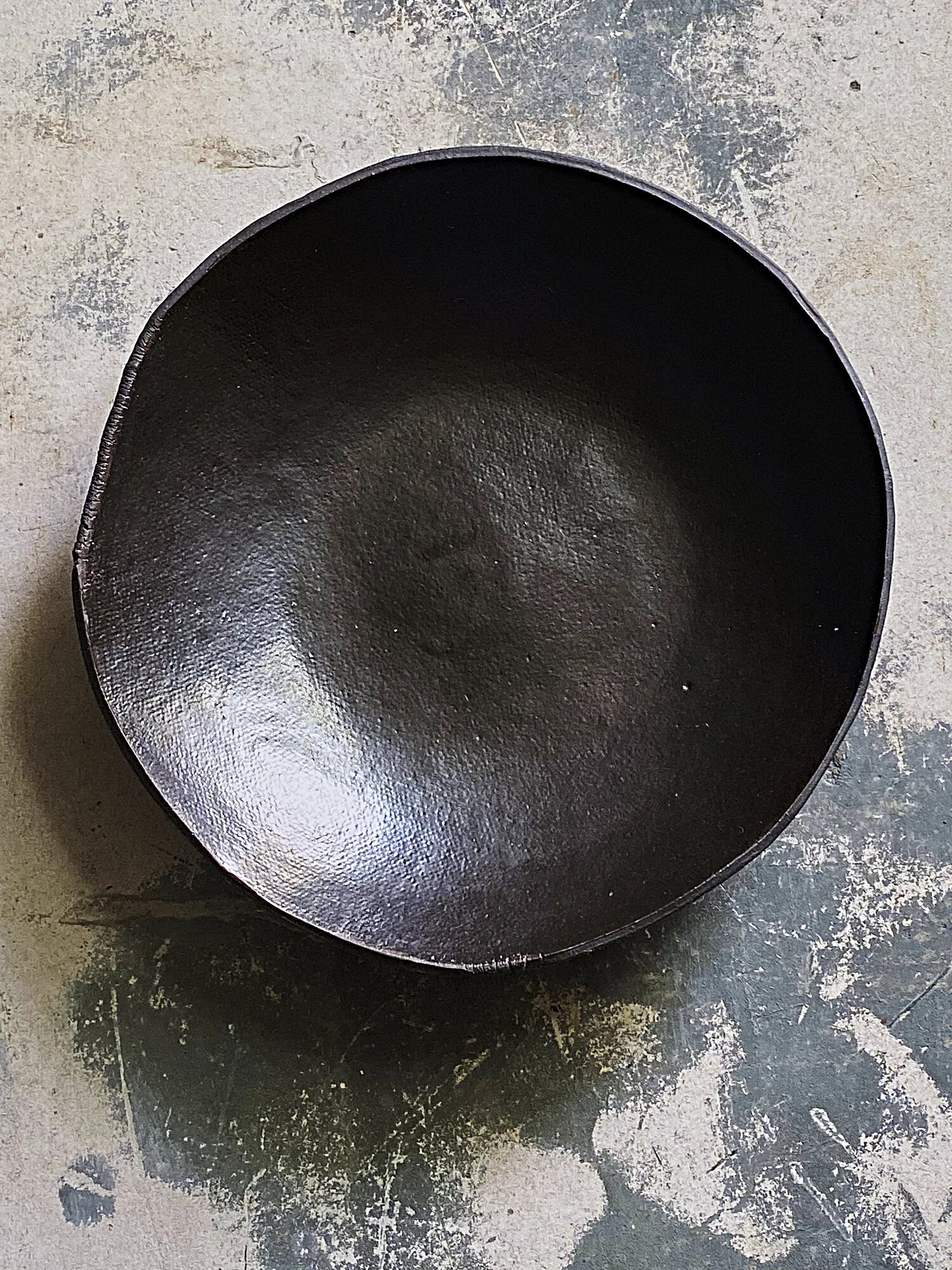 shallow black bowl