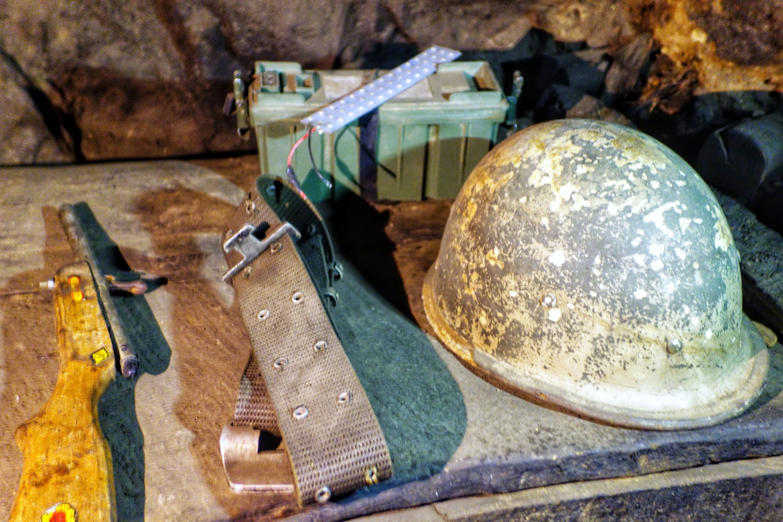 A Old Pakistani Belt and Helmet left over from the 1971 war. Also a Toy gun.