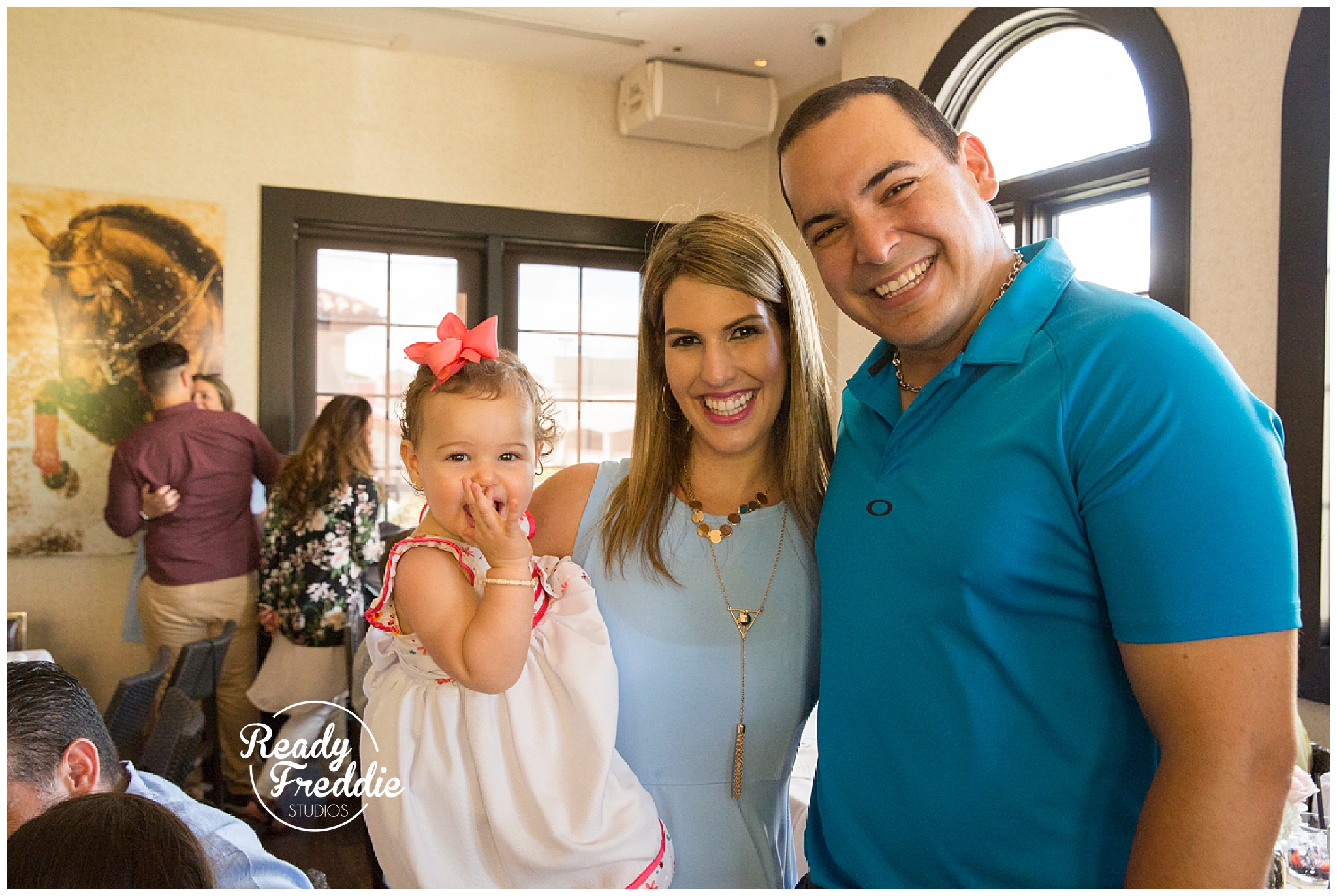 family poses in baby shower