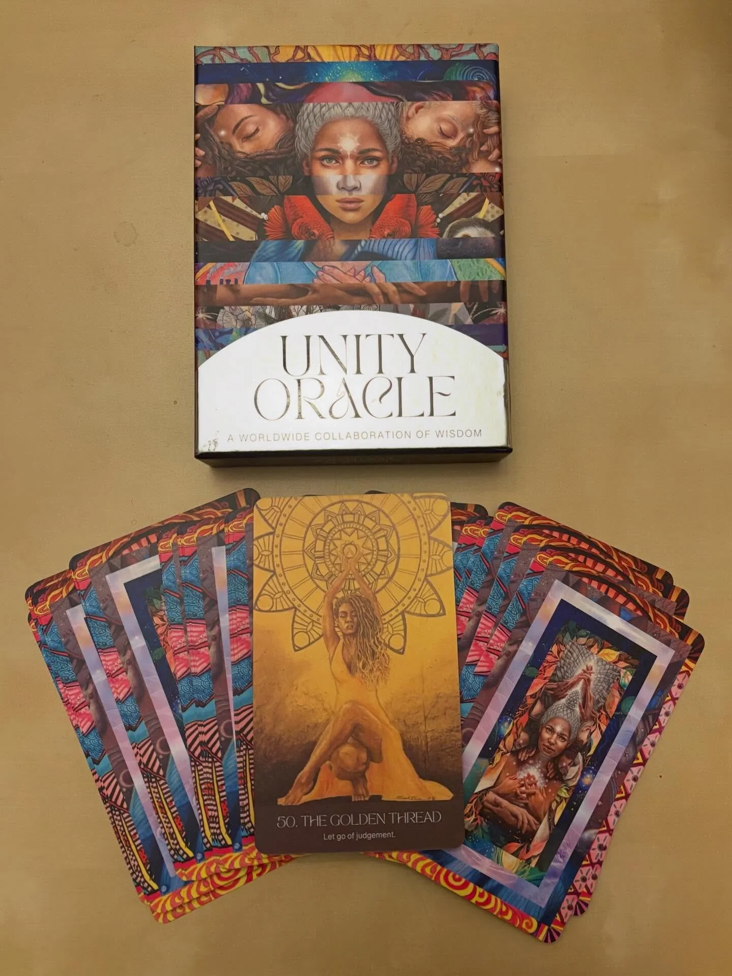 This beautiful deck is a gift that keeps on giving.

As some of you know, a few years ago I submitted art to a call for artists and writers across the globe to create an international community deck. There were names of artists I followed and admired