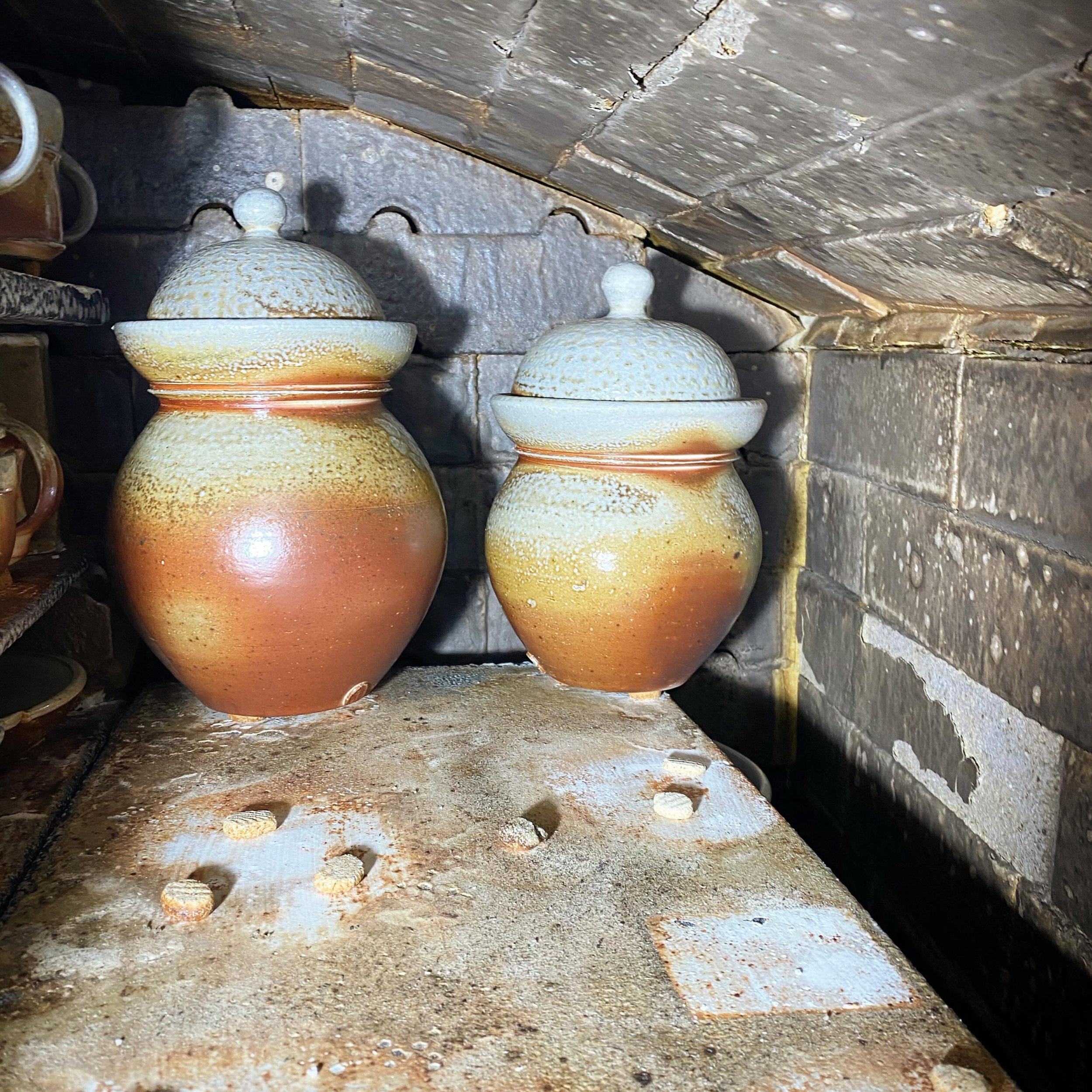 Sneak peak from the unload today! Lots of lovely pots came out. These two fermenting jars of mine were right in the back corner in the top of the soda chamber of Pepino.